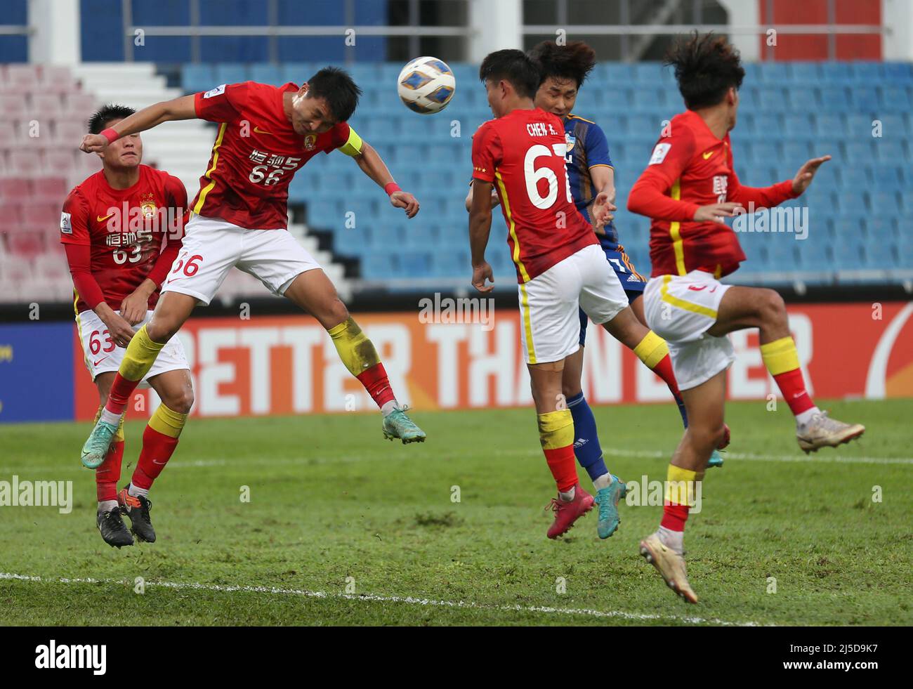 Johor Baru, Malaysia. 21st Apr, 2022. Yang Xin (L) and Chen Run (R3) of Guangzhou Evergrande are seen in action during the AFC Champions League Group I match between Guangzhou Evergrande and Ulsan Hyundai at the Tan Sri Dato Hj Hassan Yunos Stadium. (Final score: Guangzhou Evergrande 0:3 Ulsan Hyundai) (Photo by © Wong Fok Loy/SOPA Images/Sipa USA) Credit: Sipa USA/Alamy Live News Stock Photo