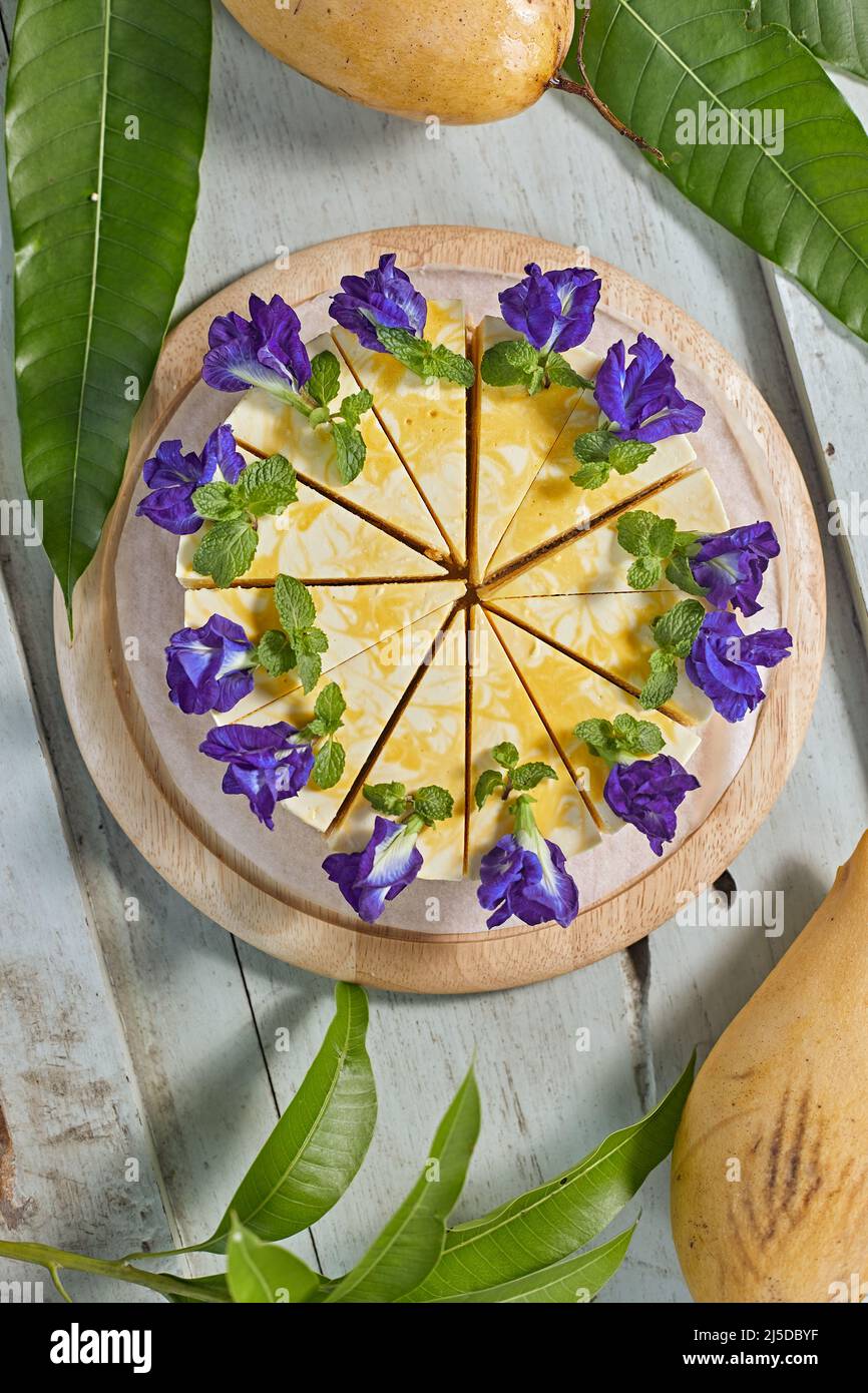 mango cheese cake on wood background,selective focus Stock Photo