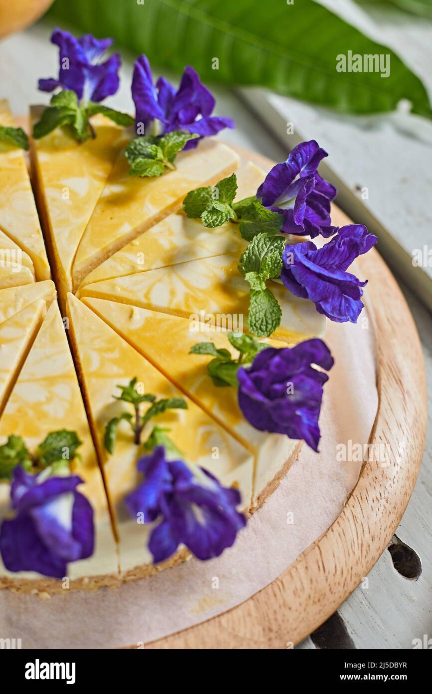 mango cheese cake on wood background,selective focus Stock Photo