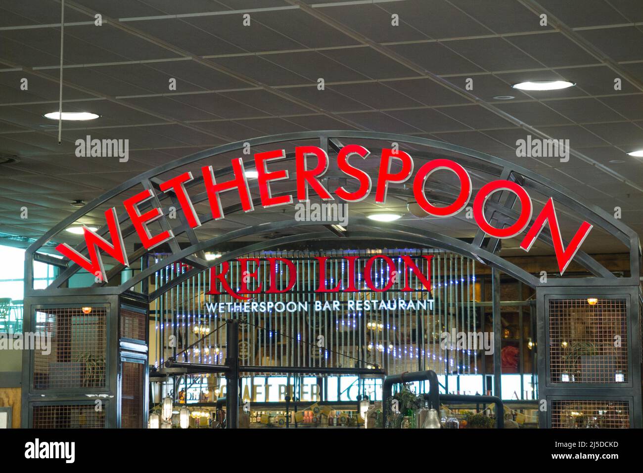 Sign / signage at The Red Lion Wetherspoon / Wetherspoons Pub / restaurant / Public House, at London Gatwick airport North Terminal, Crawley. UK (129) Stock Photo