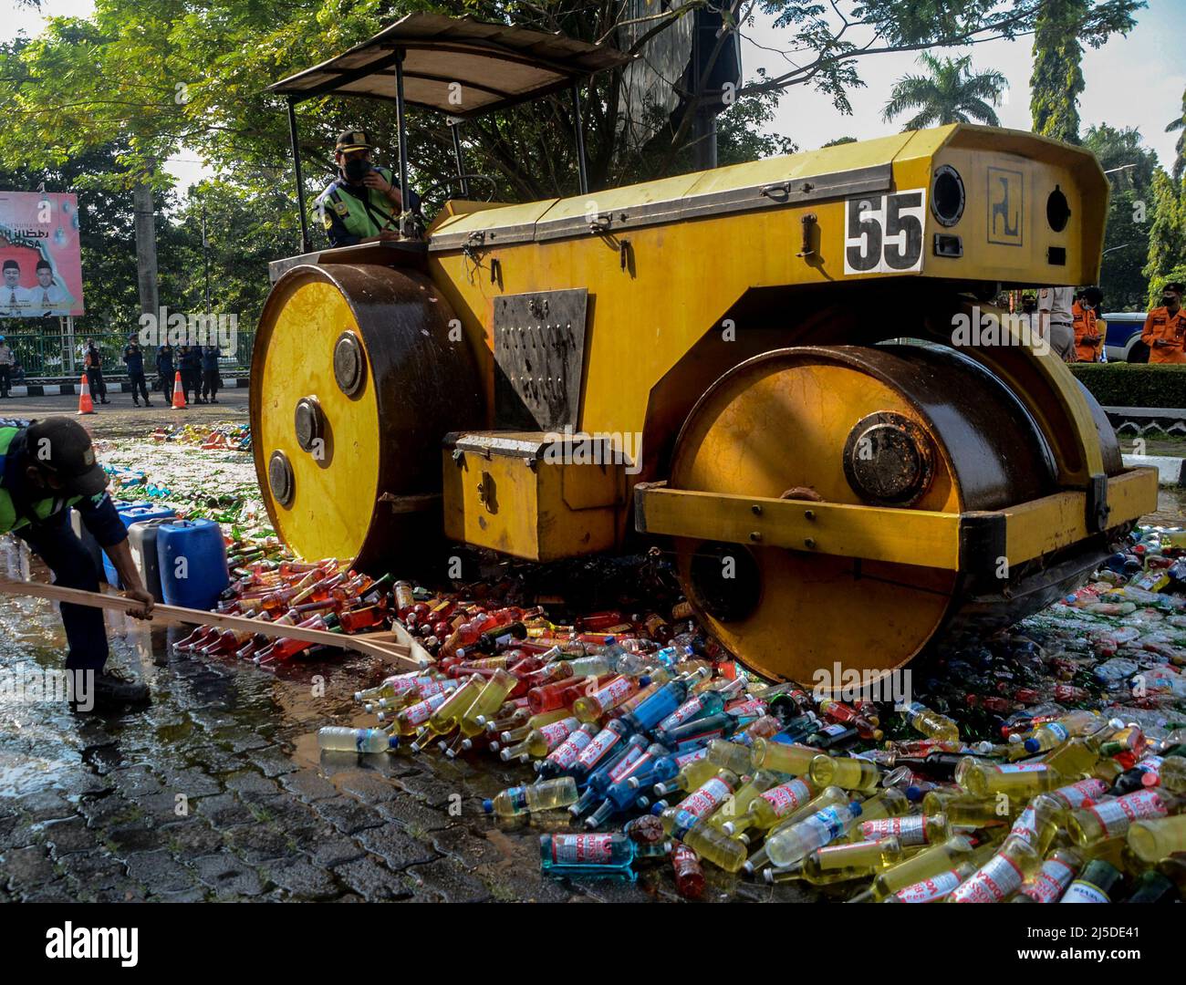 Bogor, Indonesia. 22nd Apr, 2022. A steamroller crushes bottles of illegal alcohol during the Ramadan month in Bogor, West Java, Indonesia, April 22, 2022. Credit: Sandika Fadilah/Xinhua/Alamy Live News Stock Photo