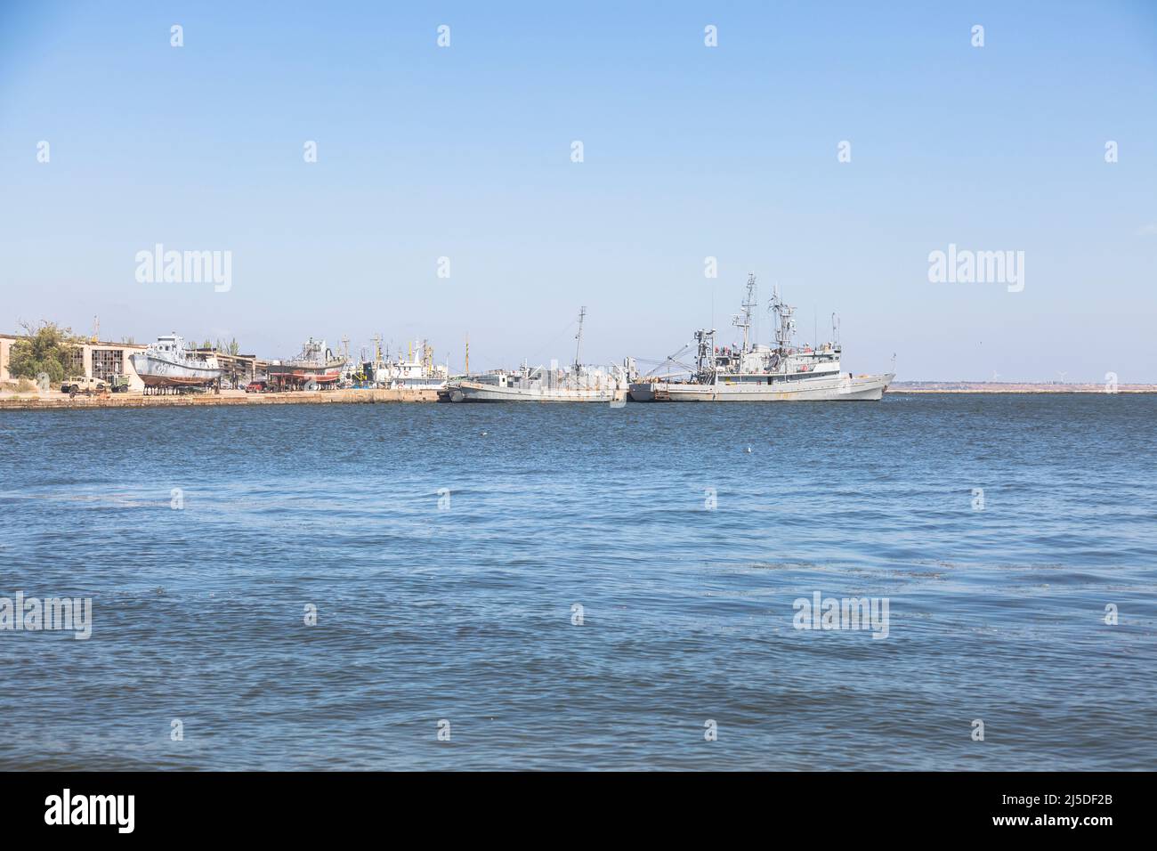 OCHAKIV, MYKOLAIV REGION, UKRAINE - Sept 16 2019: Ukrainian warships and boats near the pier in the Black Sea Stock Photo