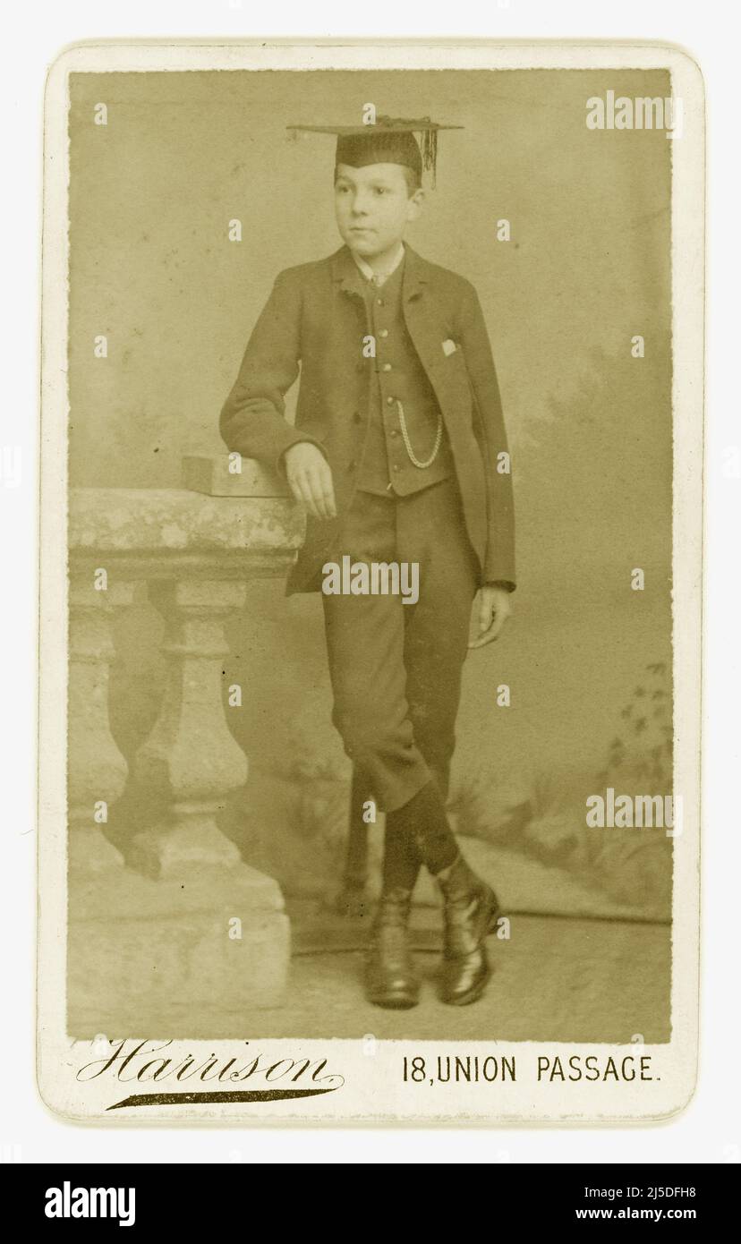 Original Victorian CDV (Carte de visite or visiting card) of confidant looking middle classed teenage Victorian boy, Victorian schooboy. wearing mortarboard from studio of J. Harrison, 18 Union Passage, Birmingham, U.K. Circa 1880 Stock Photo