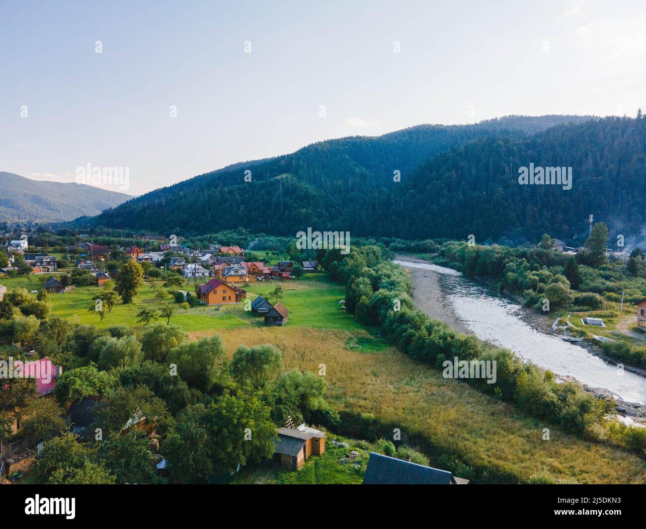 overhead view of ukrainian village in carpathian mountains summertime ...