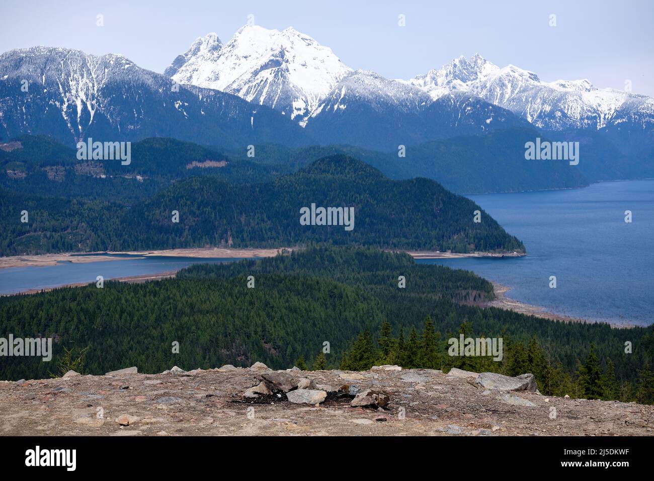 Spectacular view of Stave Lake, forest and snow-capped mountains from viewpoint on Hunter Logging Road hiking trail, near Mission, BC Stock Photo