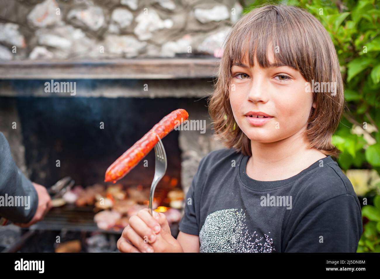 Teenage boy cooking steak hires stock photography and images Alamy