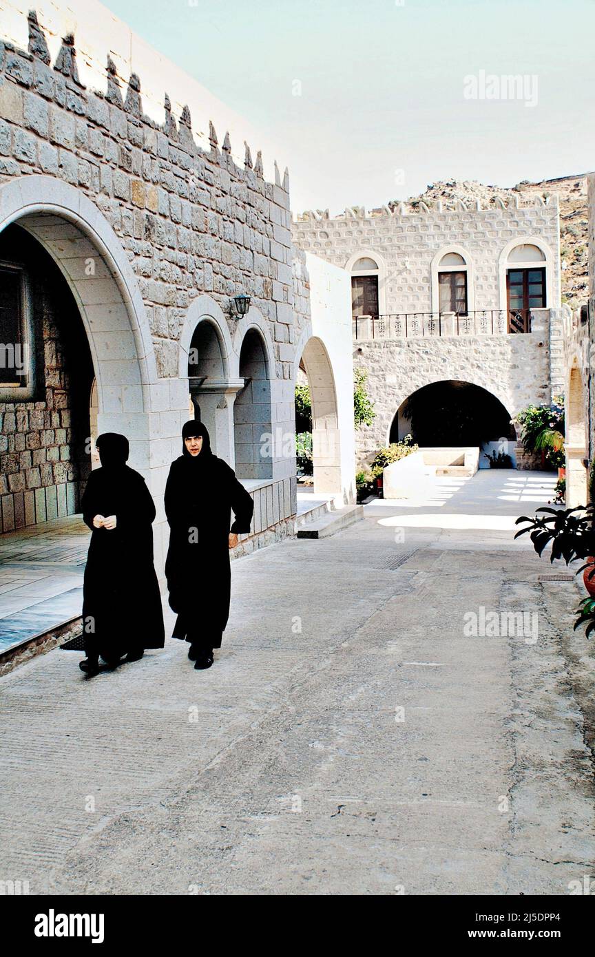 View of nuns inside the female Monastery Of Zoodochos Pighi in the town of Hora, Patmos island, Greece, August 16 2006. Stock Photo