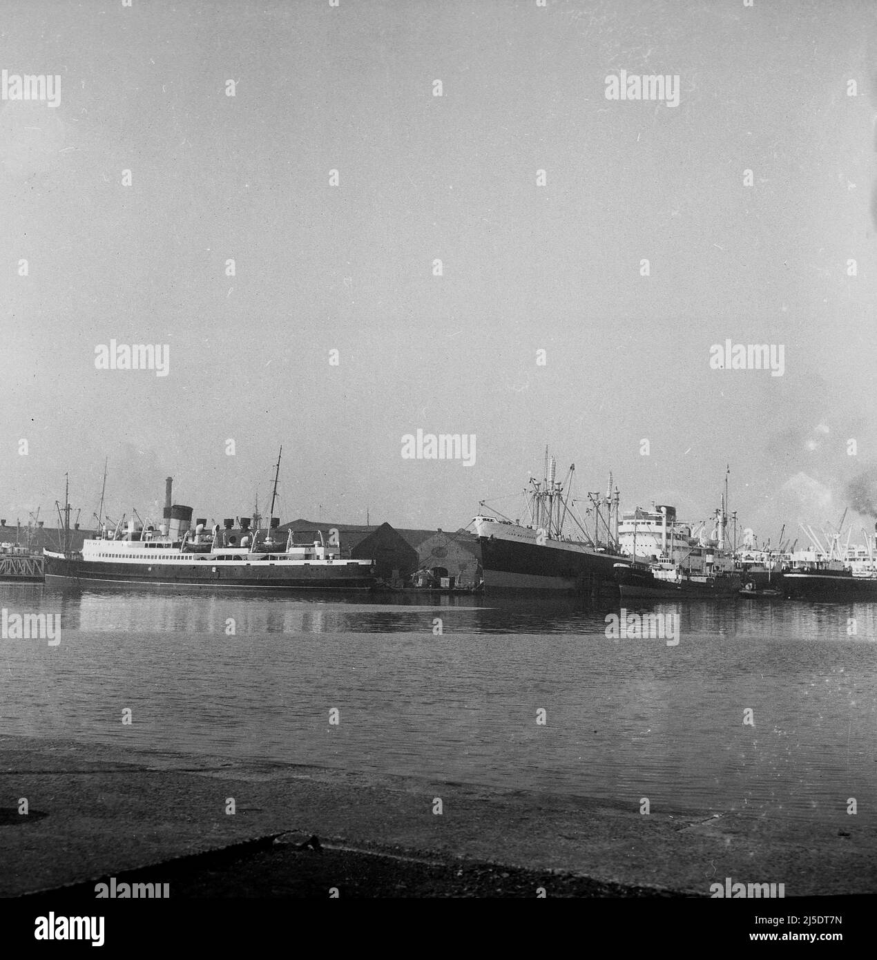 1961, historical, container ships docked at Birkenhead, Liverpool, including the cargo ship, SS Clan Maclaren, one of the many ships of the Clan Line, which in this era were part of British and Commonwealth Shipping Ltd, who also owned the Union-Castle Line. As cargo shipping changed into what is now container shipping, the Clan Line ceased trading in 1981. The docks at Birkenhead closed in 1993. Stock Photo