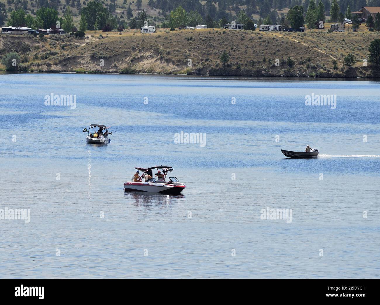 People enjoy a day on the lake.in different types of boats. Stock Photo