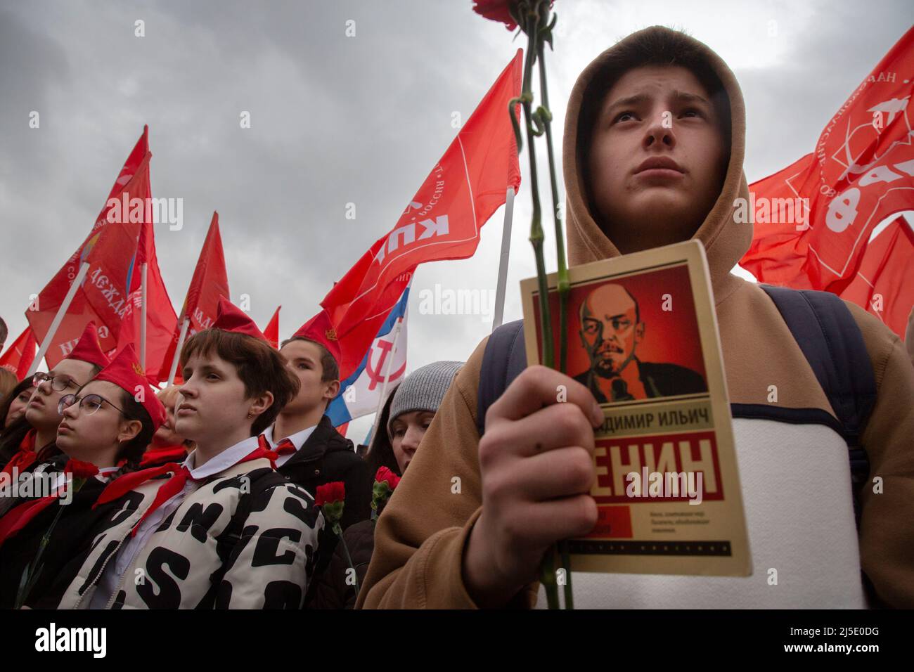 Moscow, Russia. 22th April, 2022. Members and supporters of the Communist Party the Russian Federation (CPRF) are seen during a flower laying ceremony at the Mausoleum in Red Square to mark the 152nd birthday of Vladimir Lenin in Moscow, Russia. Credit: Nikolay Vinokurov/Alamy Live News Stock Photo