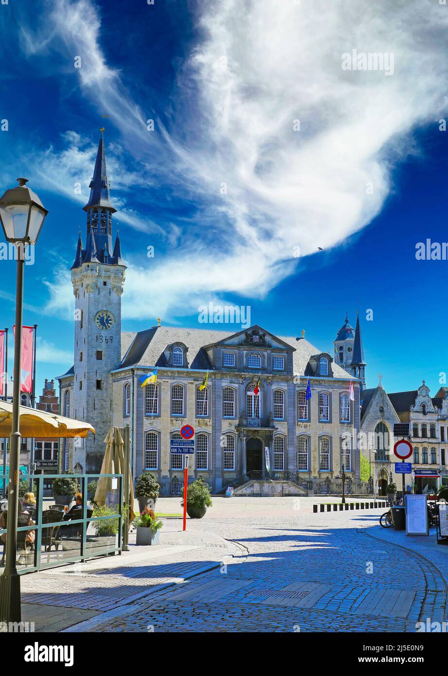 Lier (grote markt), Belgium - April 9. 2022: View over market square on medieval town hall with tower against spectacular blue sky Stock Photo