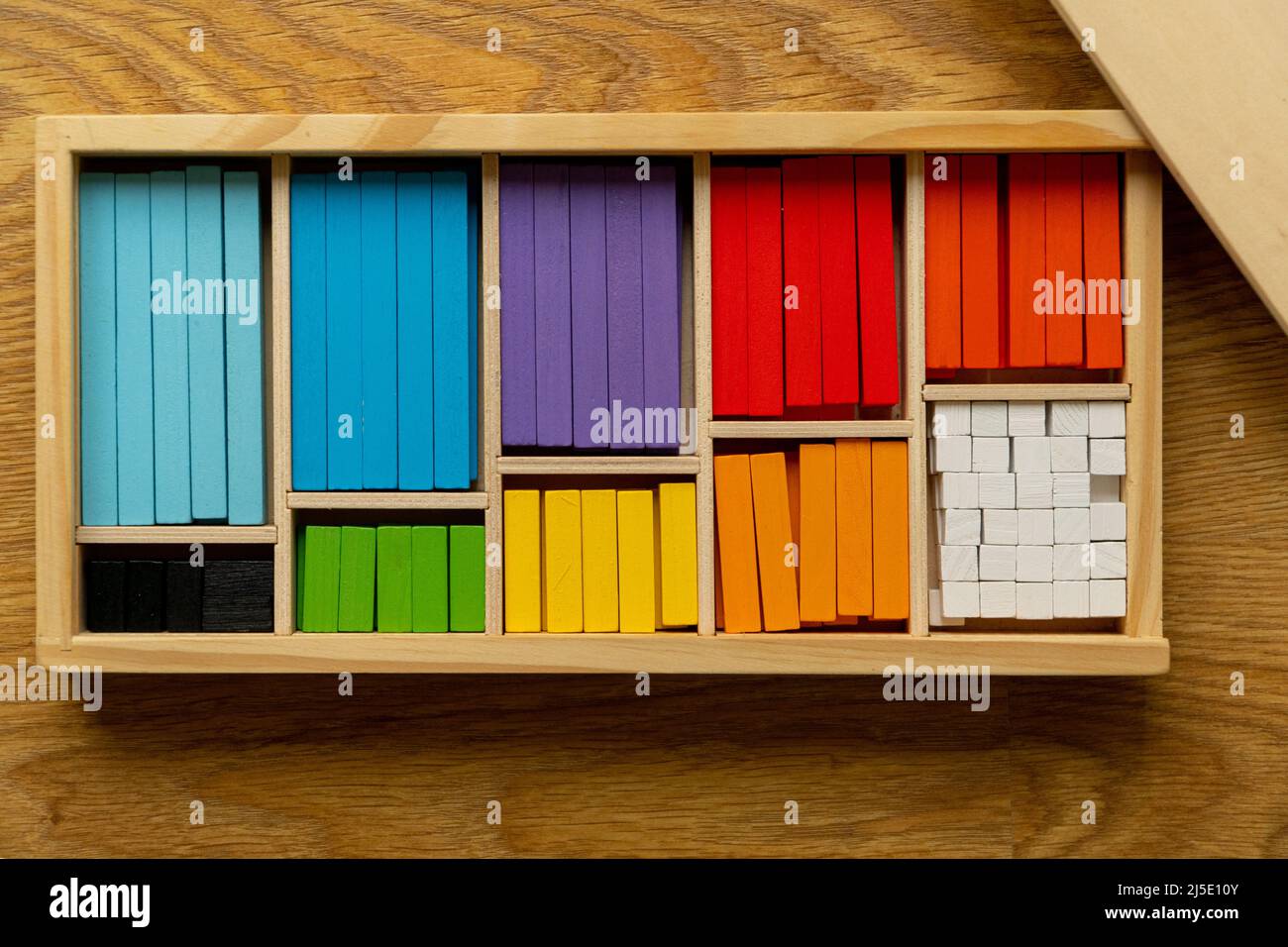 Counting math rods organized in wooden box. manipulative material for