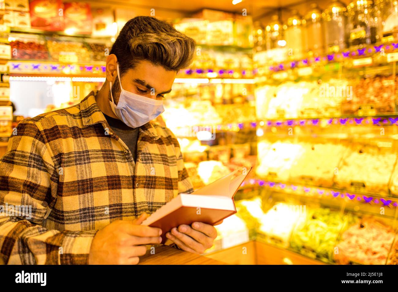 handsome arabian man selling turkish delight arrangement Istanbul