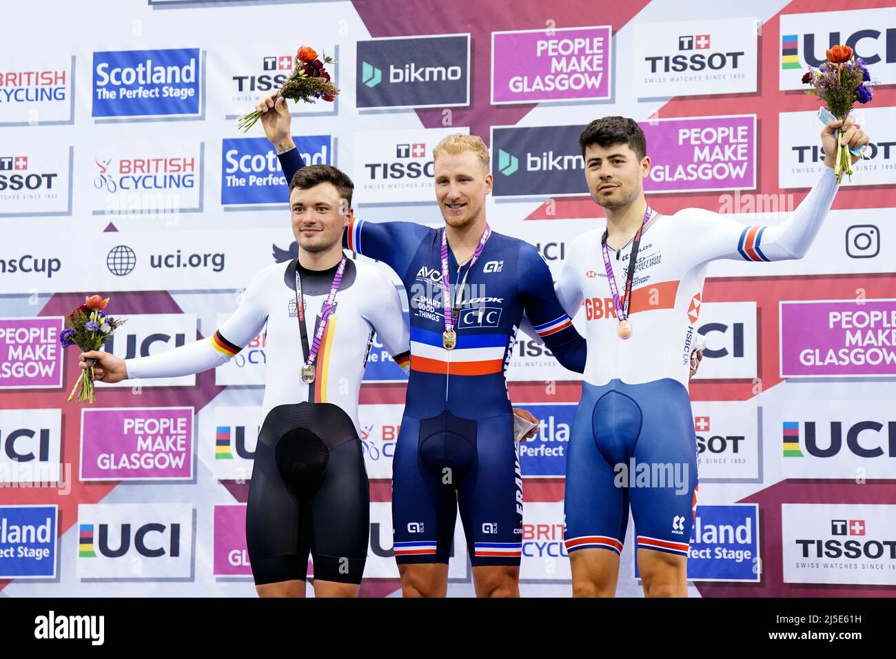 Great Britain's Charlie Tanfield is awarded bronze, Germany's Nicolas Heinrich is awarded silver and France's Corentin Ermenault is awarded gold in the Men's Individual Pursuit during day two of the Tissot UCI Track Nations Cup 2022 at the Sir Chris Hoy Velodrome, Glasgow. Picture date: Friday April 22, 2022. Stock Photo