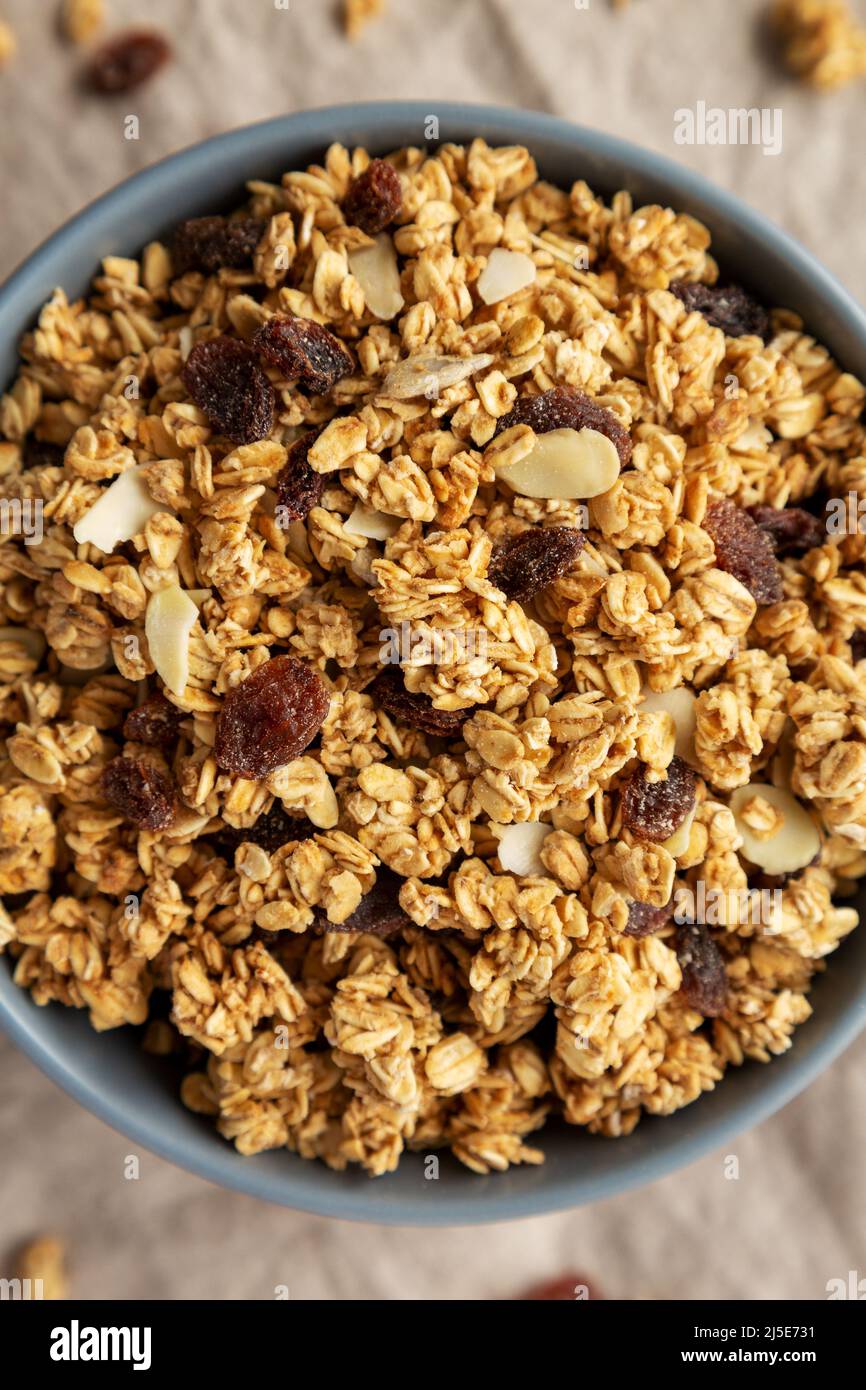 Homemade Granola with raisins and almonds in a Bowl, top view. Overhead