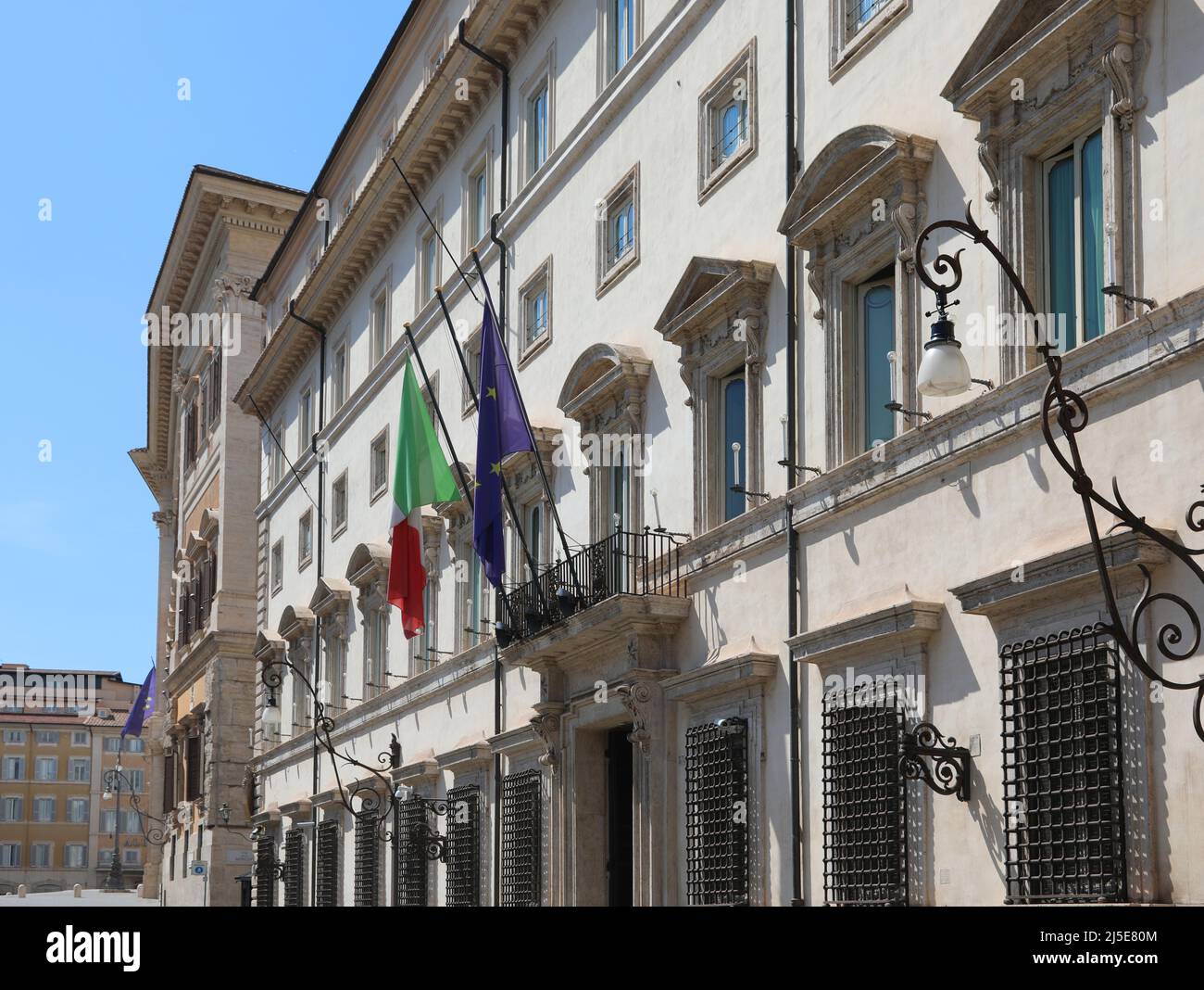Rome, RM, Italy - August 18, 2020: Italian and European flag at the entrance of Palazzo Chigi seat of the Italian government without people Stock Photo