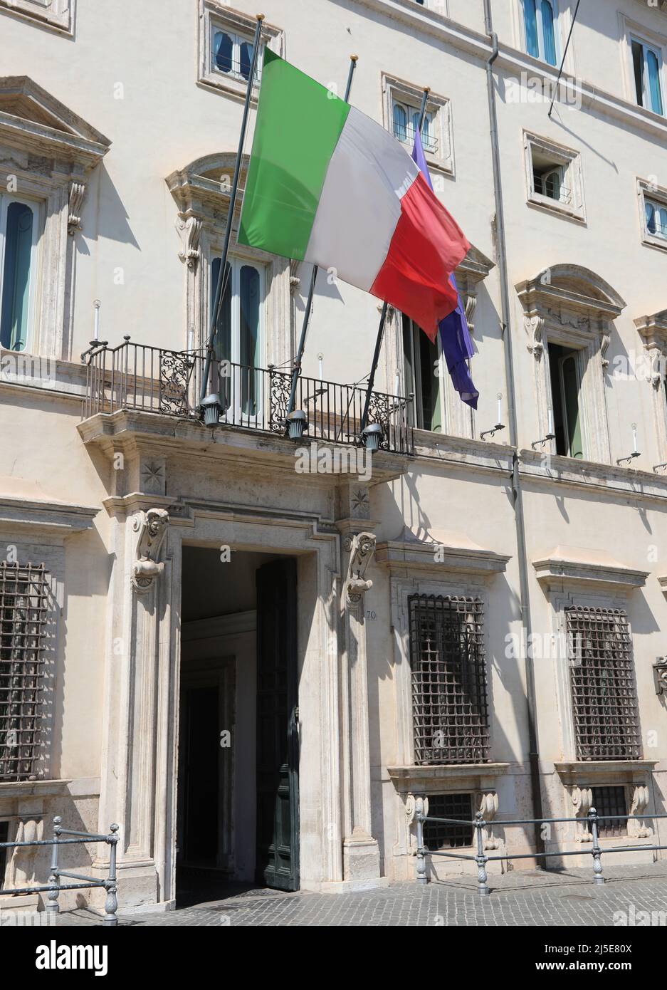 Rome, RM, Italy - August 18, 2020: Big Italian Flag at the entrance of Palazzo Chigi seat of the Italian government without people Stock Photo