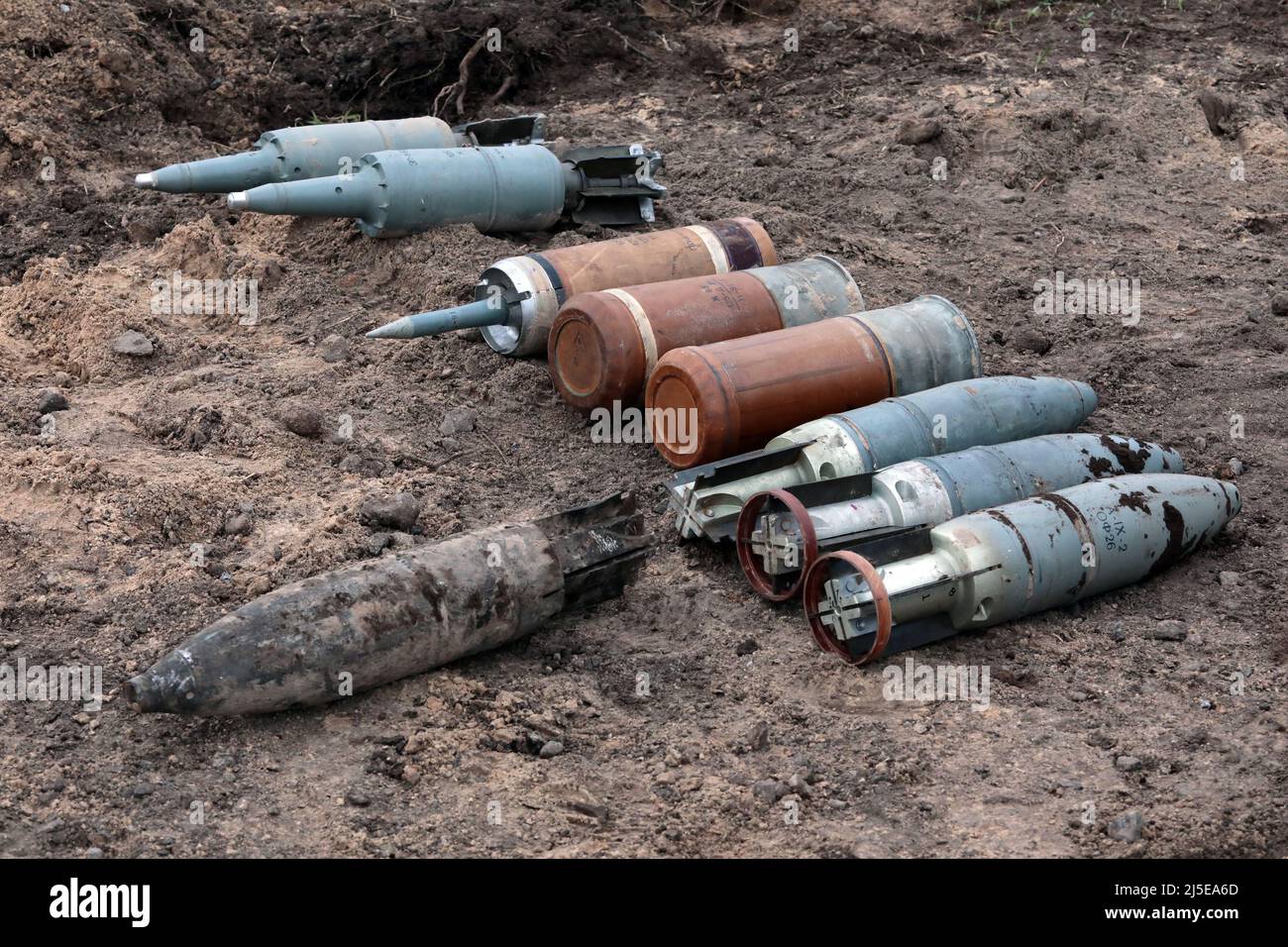 KYIV REGION, UKRAINE - APRIL 21, 2022 - Ammunition is arranged on the ground during a mine clearance mission near Bervytsia, a village liberated from Stock Photo