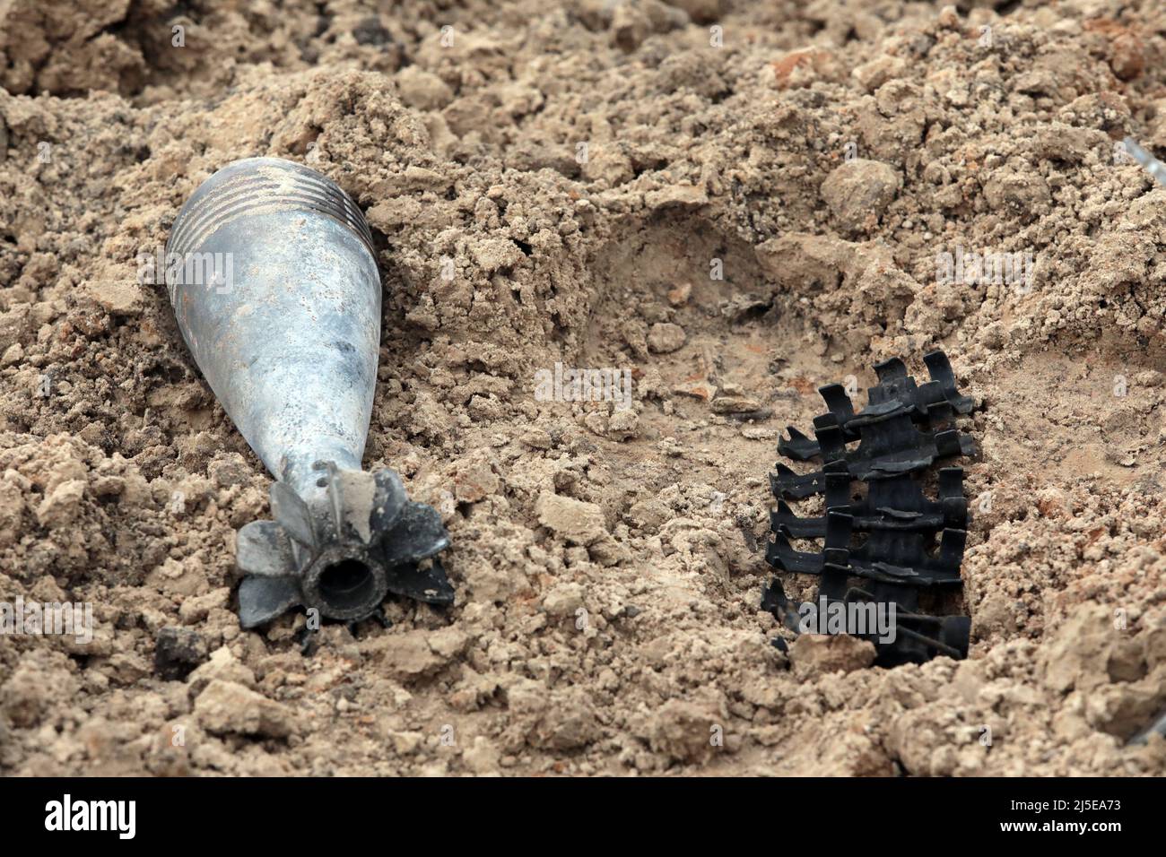 KYIV REGION, UKRAINE - APRIL 21, 2022 - Ammunition is arranged on the ground during a mine clearance mission near Bervytsia, a village liberated from Stock Photo
