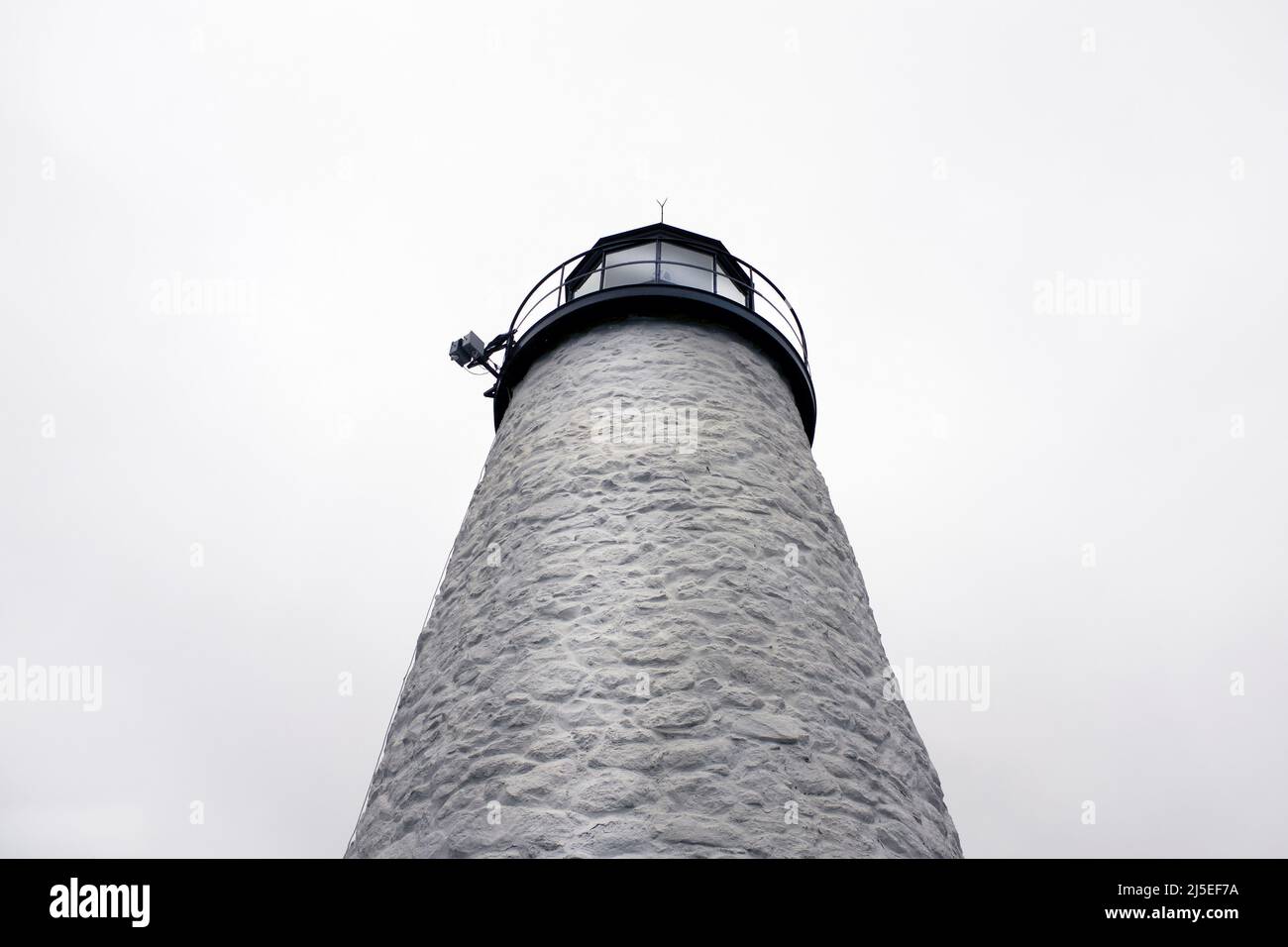 Low Angle View of Lighthouse against Foggy Sky Stock Photo