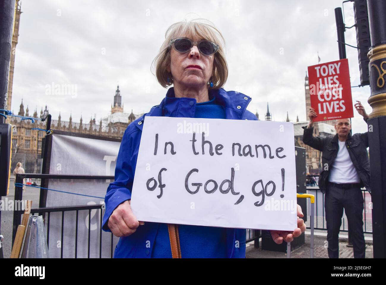 London, UK. 19th April 2022. A protester holds a sign which reads 'In the name of God, go!' Anti-Boris Johnson protesters gathered in Parliament Square ahead of the Prime Minister's appearance in the House of Commons, where he was scheduled to address the Partygate scandal. Stock Photo