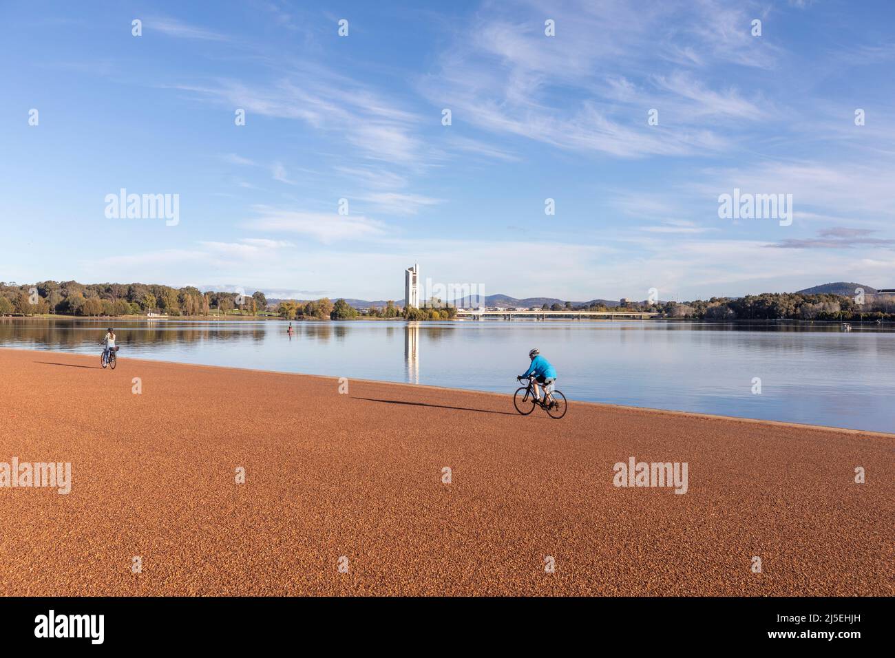 Cycling around Lake Burley Griffin in Canberra city centre on a sunny