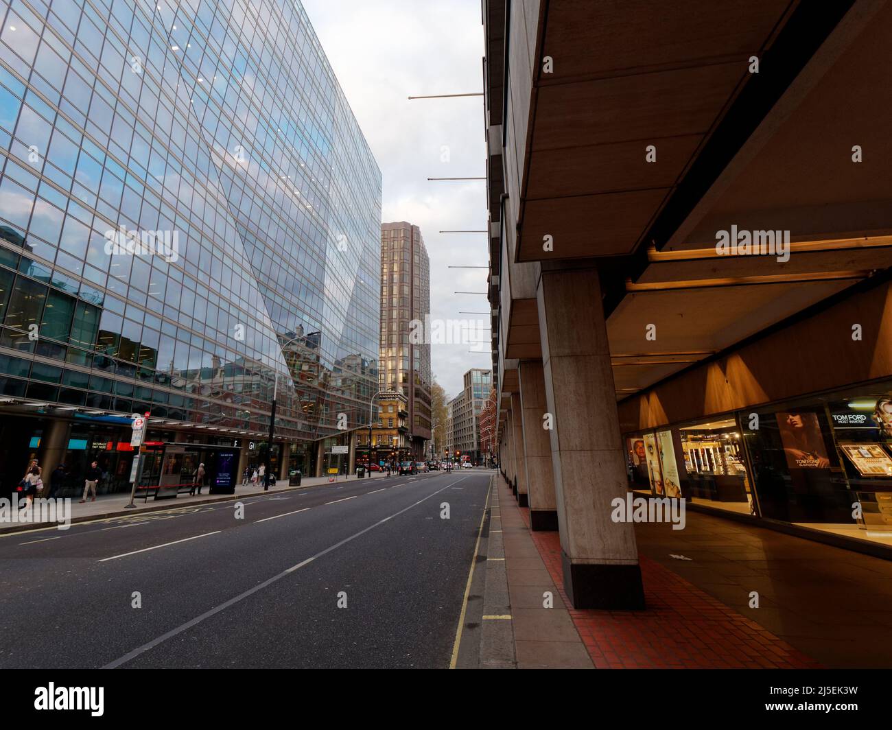 London, Greater London, England, April 13 2022: Victoria Street in Westminster in the evening showing the covered pavement area. Stock Photo