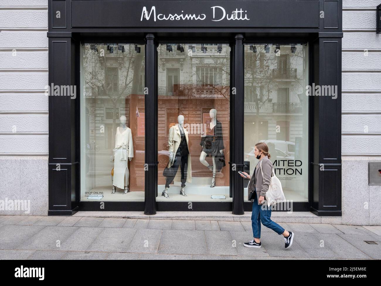A pedestrian walks past the Spanish clothing manufacturing and brand Massimo  Dutti store in Spain Stock Photo - Alamy