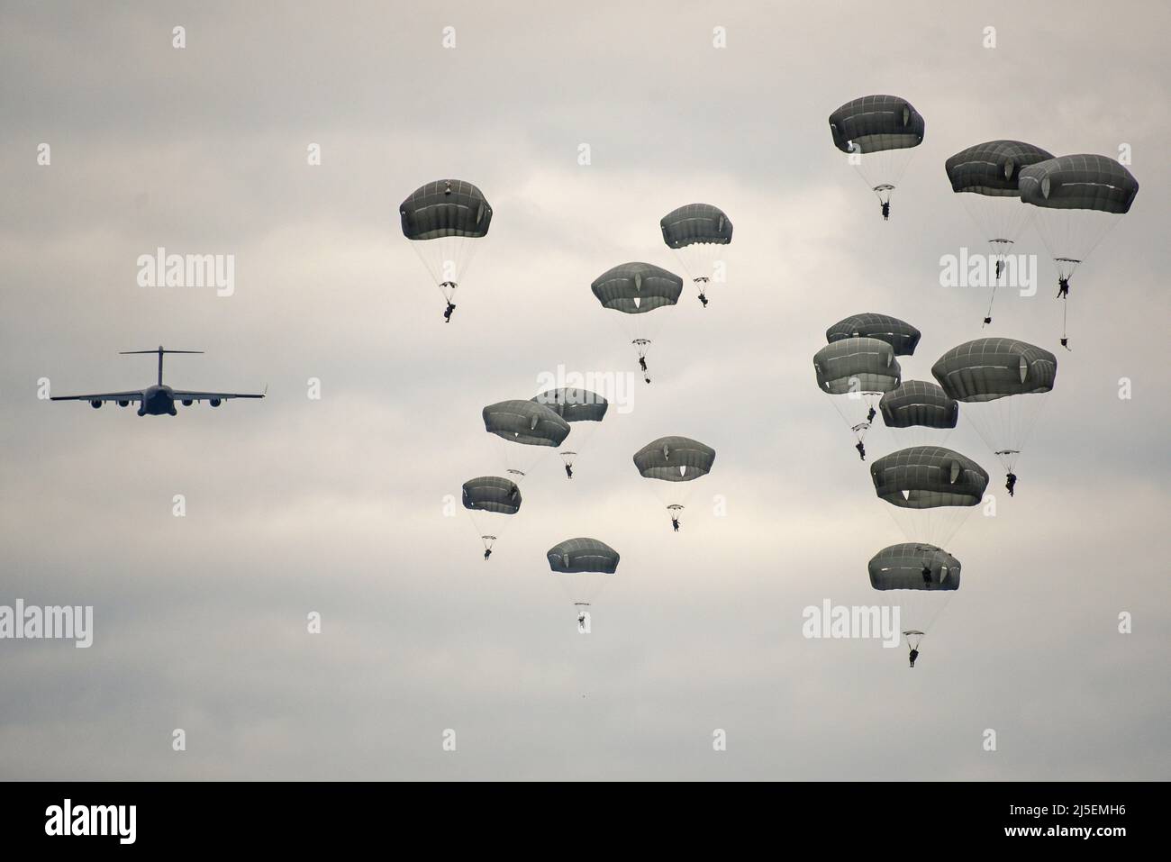 U.S. Army paratroopers assigned to 173rd Airborne Brigade jump out of a