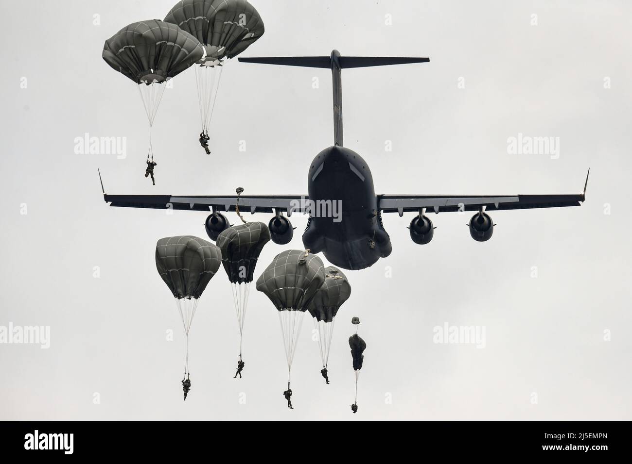U.S. Army paratroopers assigned to 173rd Airborne Brigade jump out of a