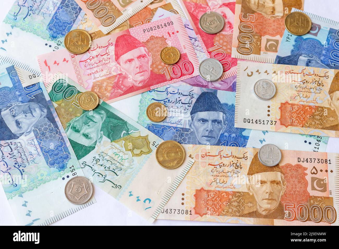 Pakistani paper currency notes with coins Stock Photo