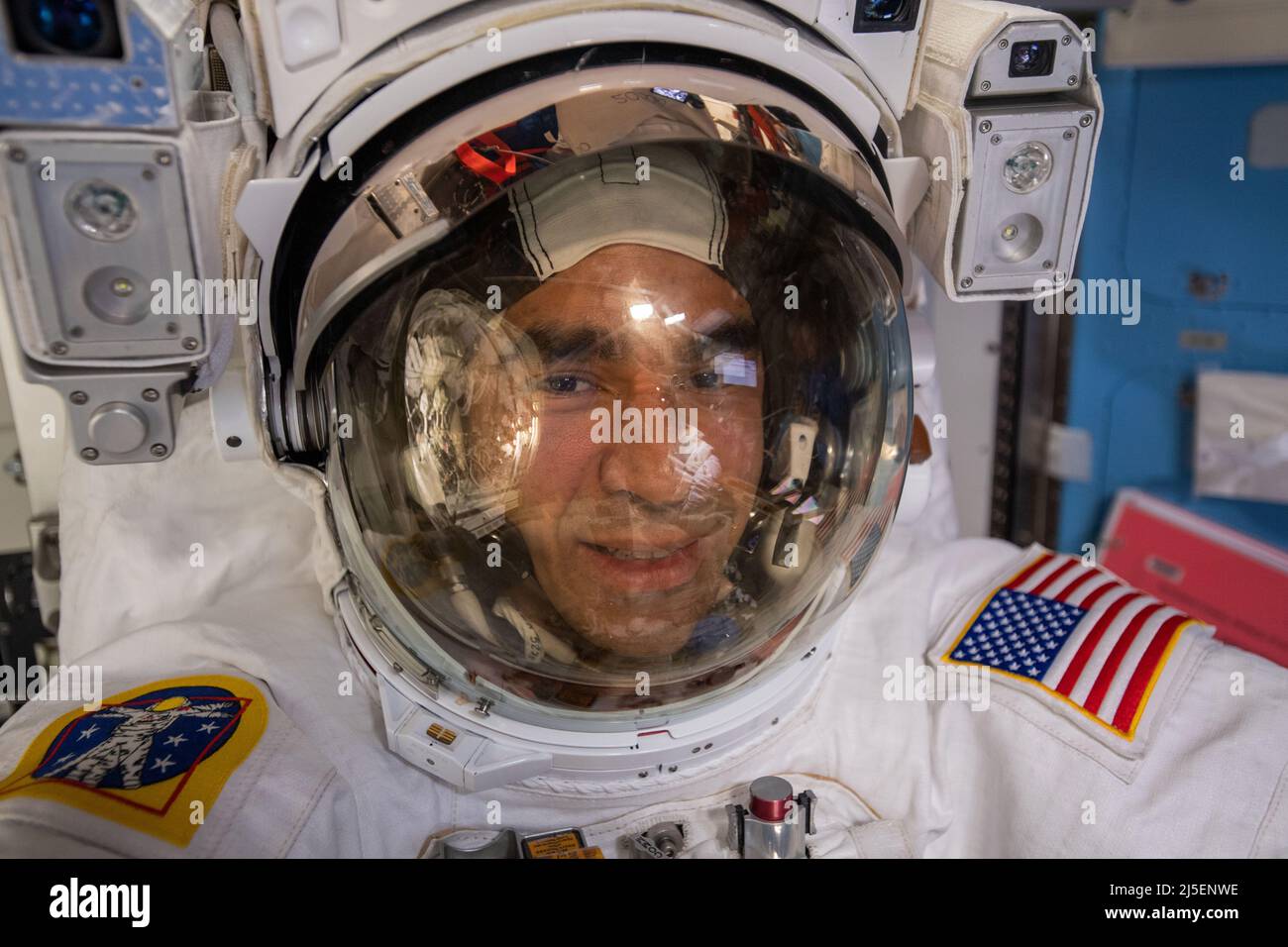 International Space Station, EARTH ORBIT. 23 March, 2022. NASA astronaut and Expediution 66 Flight Engineer Raja Chari takes a selfie during a six-hour and 54-minute spacewalk to install thermal gear and electronic components on the International Space Station, March 23, 2022 in Earth Orbit.  Credit: NASA/NASA/Alamy Live News Stock Photo