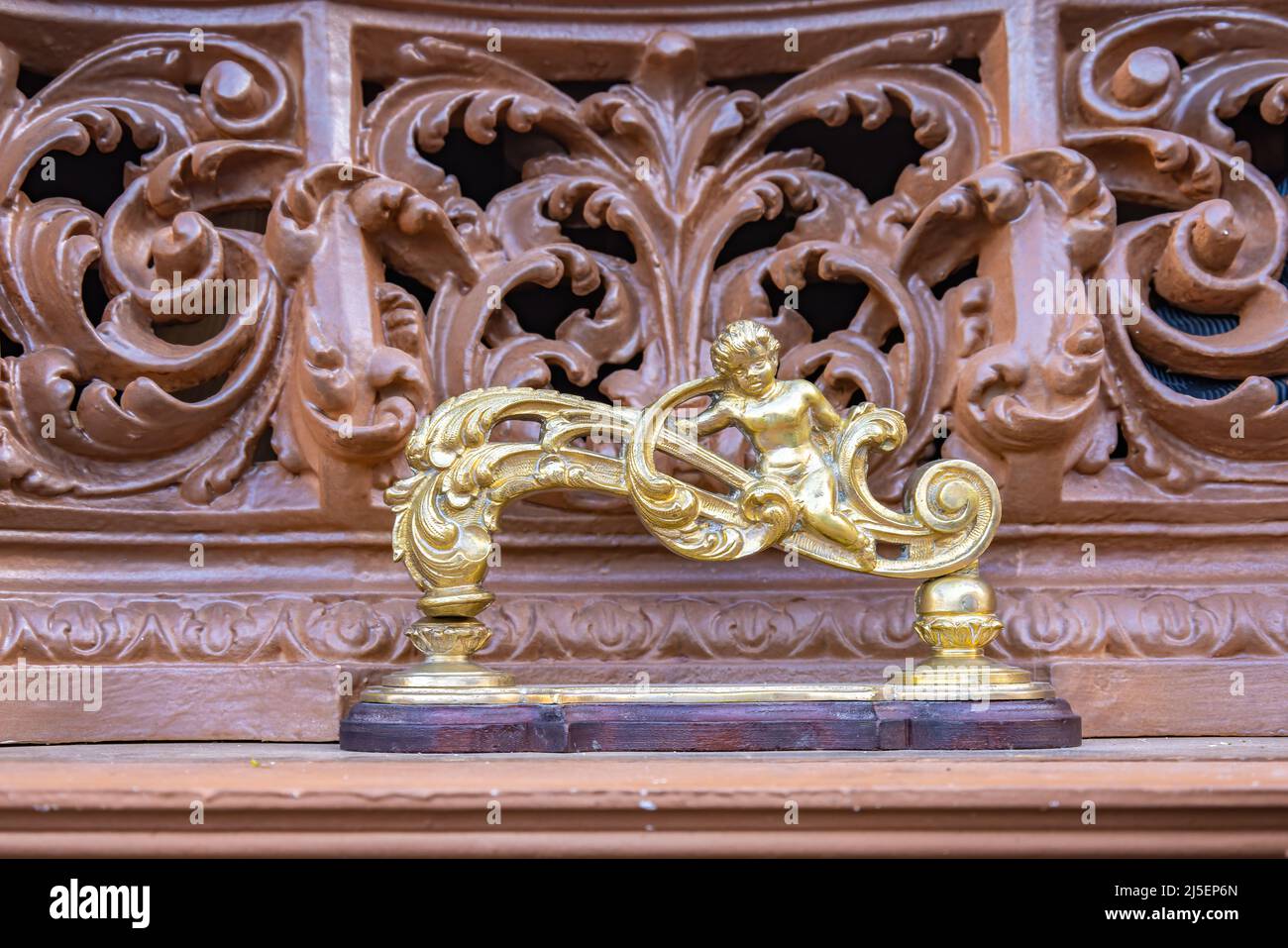 Detail of golden knocker (llamador) in the form of an Angel in a paso (platform or throne) of the Holy Week in procession Stock Photo