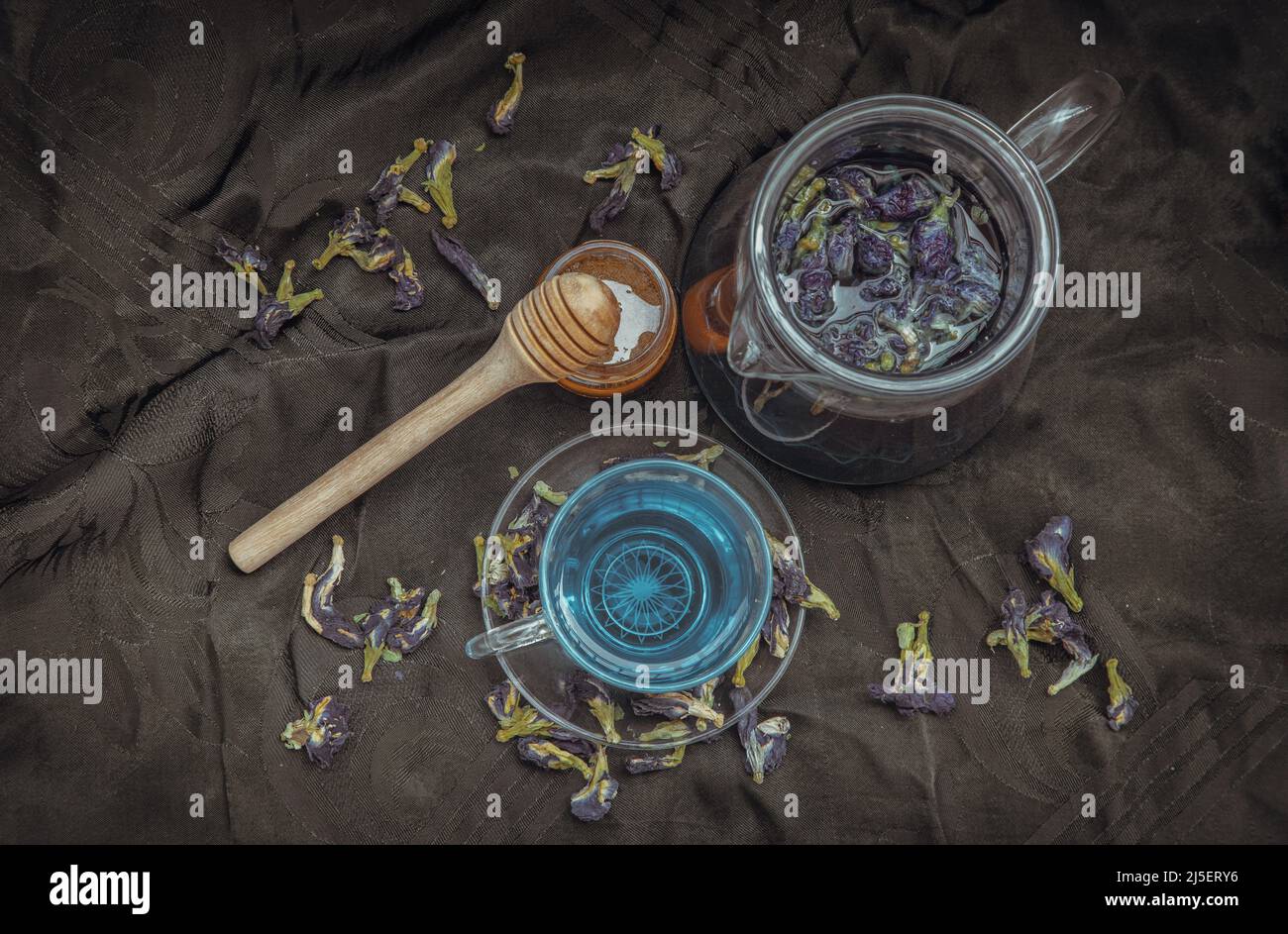 Butterfly pea tea (Clitoria) or Organic blue anchan in Teapot and glass ...
