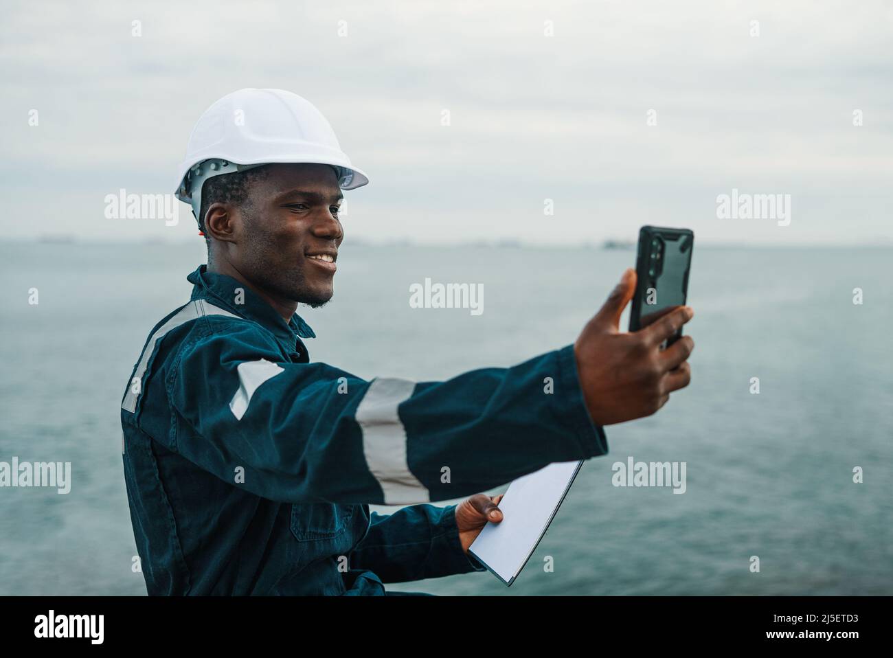 Bosun or seaman officer is taking selfie on the mobile cell phone Stock Photo