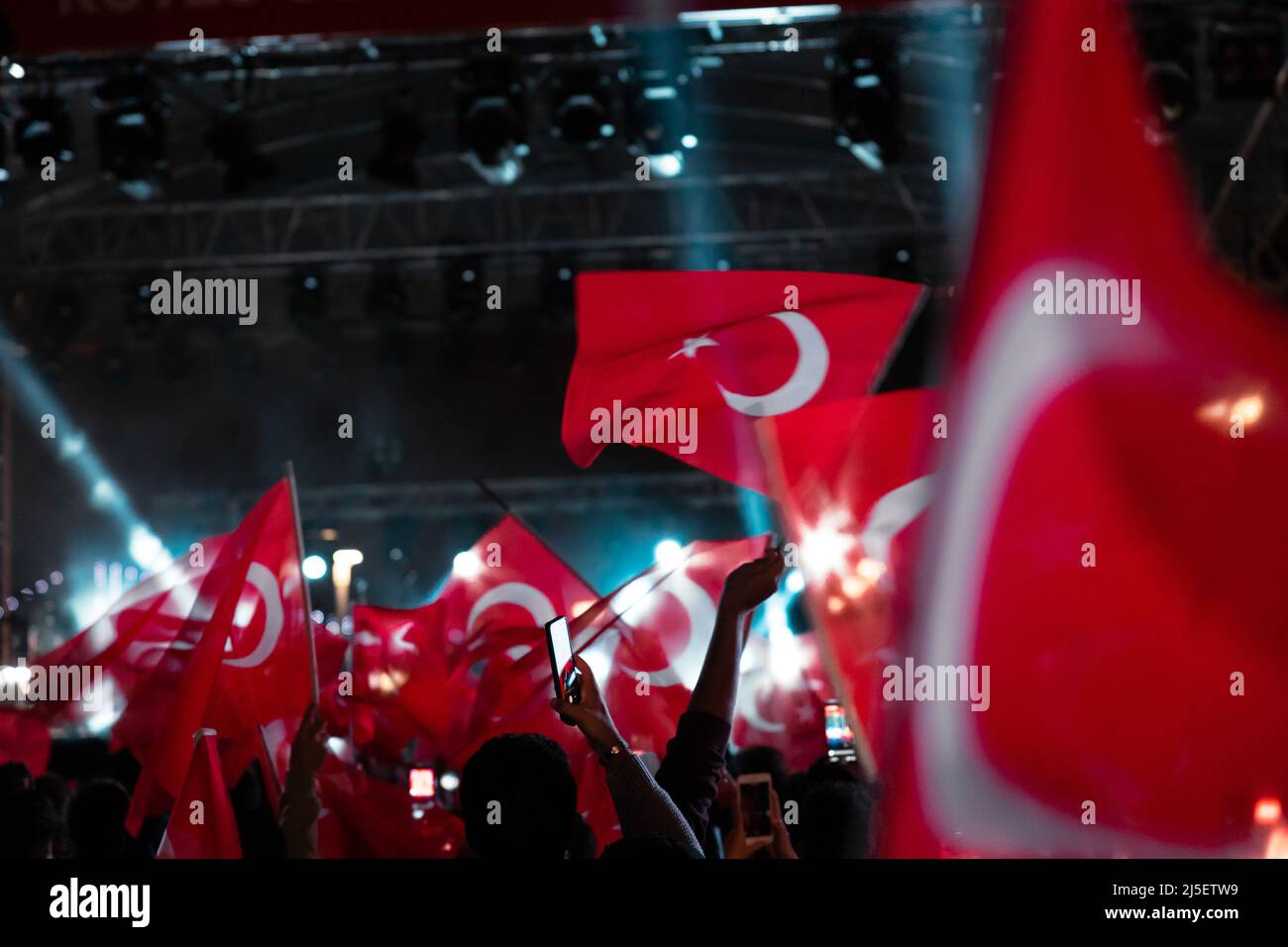 Turkish people celebrated of national days at night. Motion blur on the flags. People waving