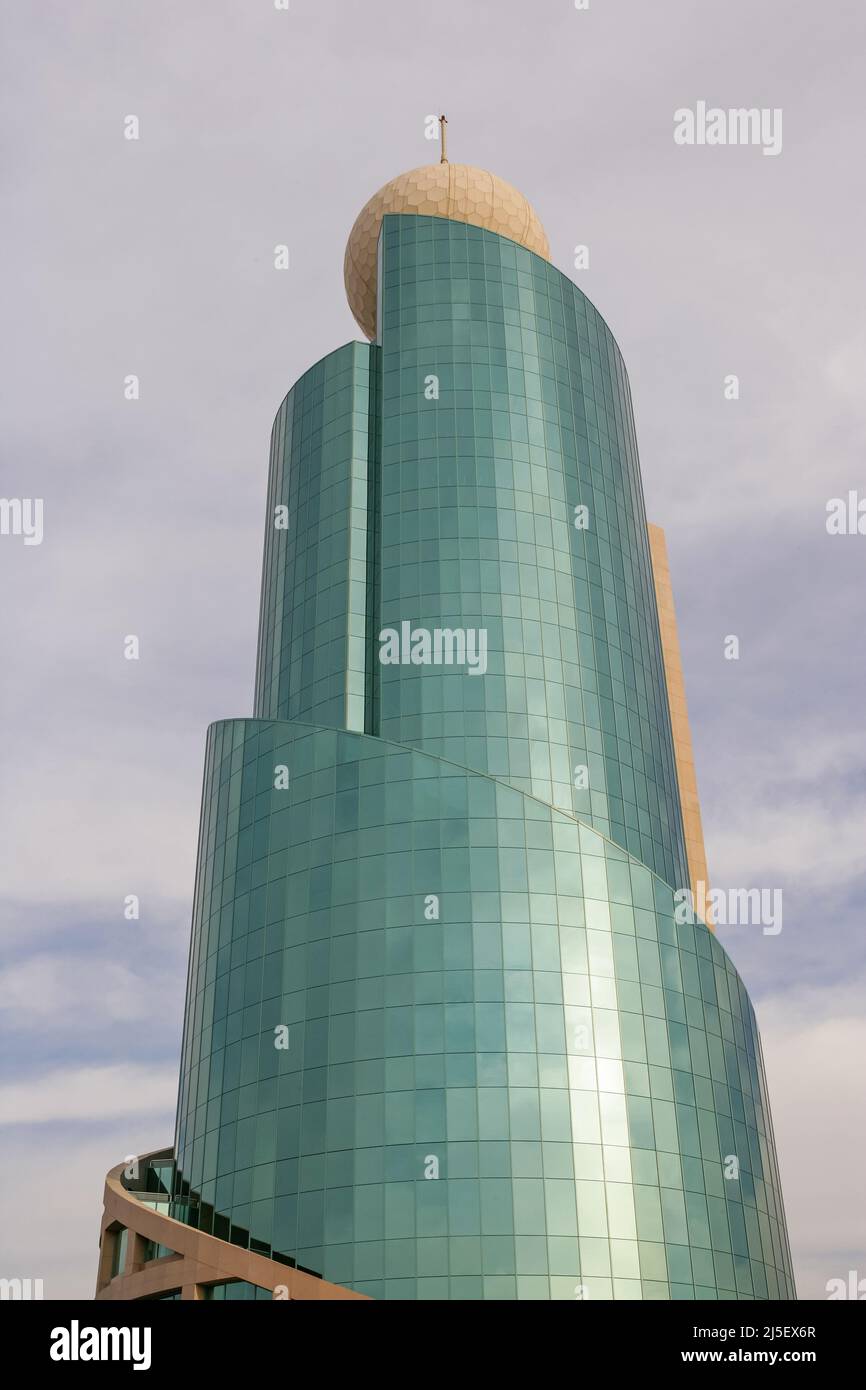 The Etisalat Tower in Sharjah, in the UAE, is designed to look like an Islamic minaret and is topped by an iconic golf-ball-like sphere. Stock Photo