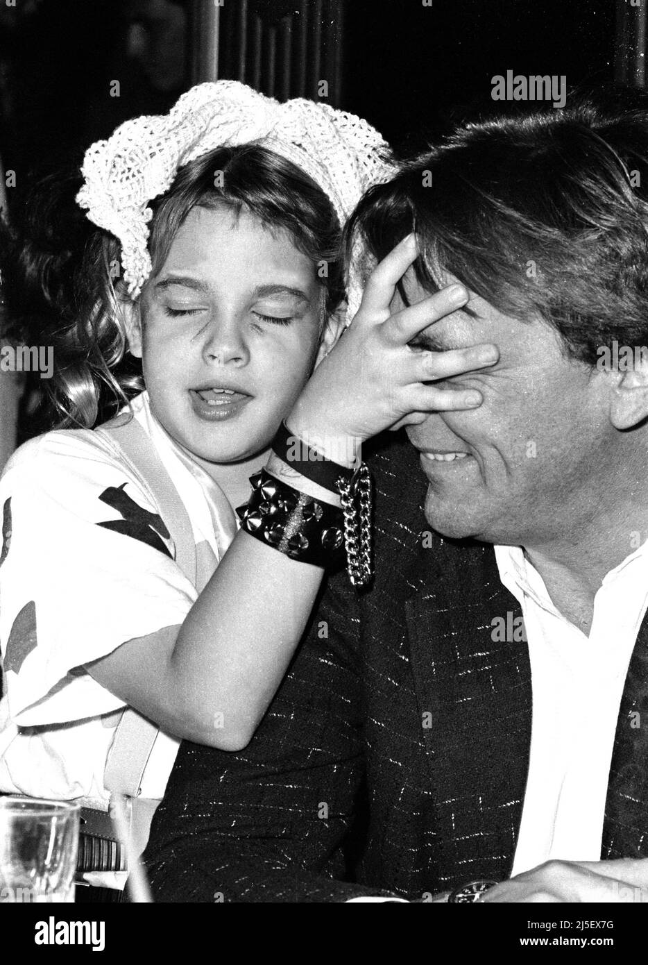 Exclusive photos of Drew Barrymore as a child attending a party sitting  with her mother's attorney at the Palace in Hollywood, 1985 Credit: Ron  Wolfson / MediaPunch Stock Photo - Alamy