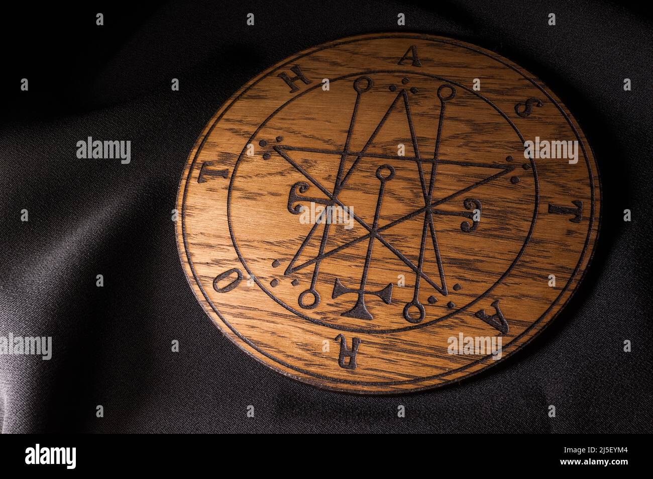 A Ouija Board, yellow on a black background Stock Photo