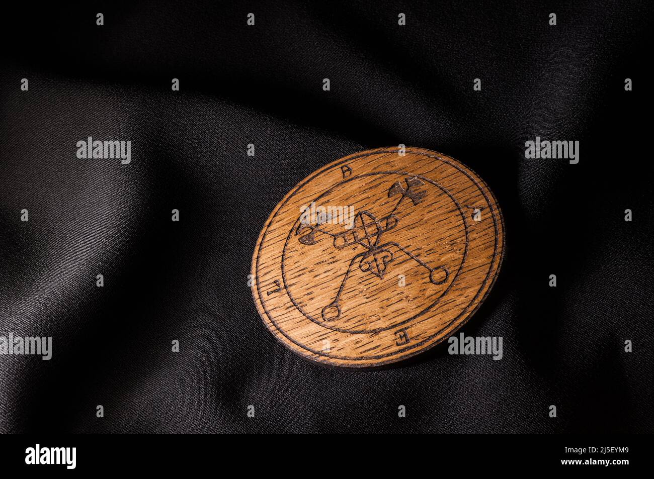 A Ouija Board, yellow on a black background Stock Photo