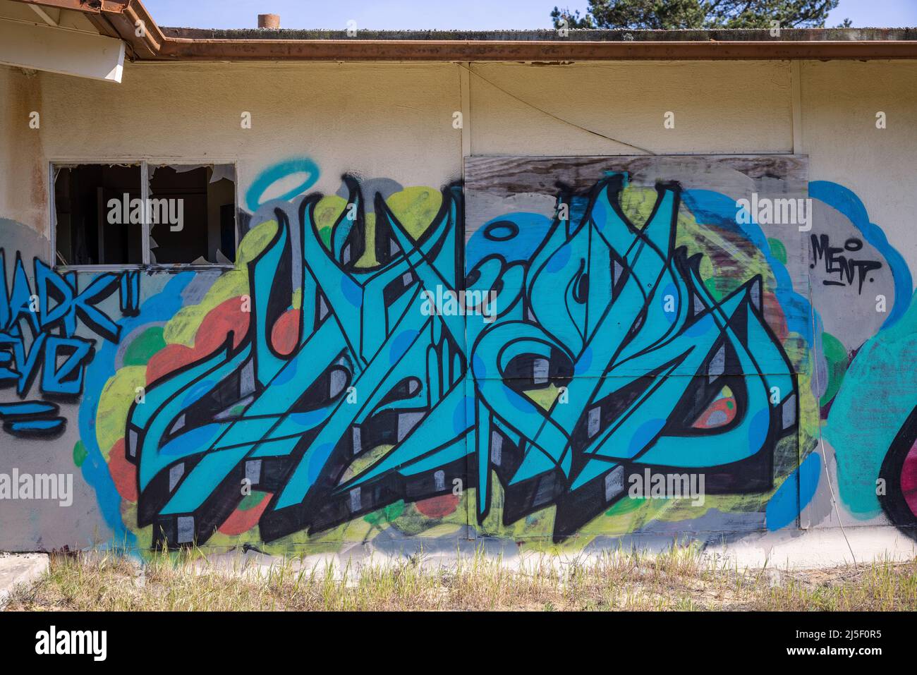 Graffiti on the side of an abandoned house on old Fort Ord. Stock Photo