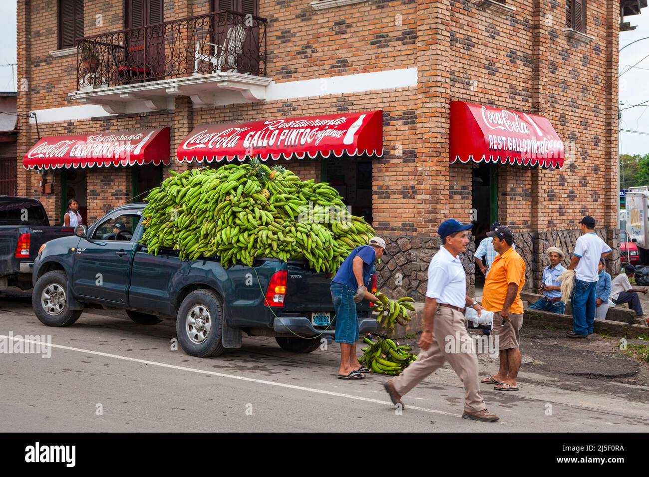A truckdriver is delivering plantain at the Gallo Pinto restaurant in Penonome, Cocle province, Republic of Panama, Central America. Stock Photo