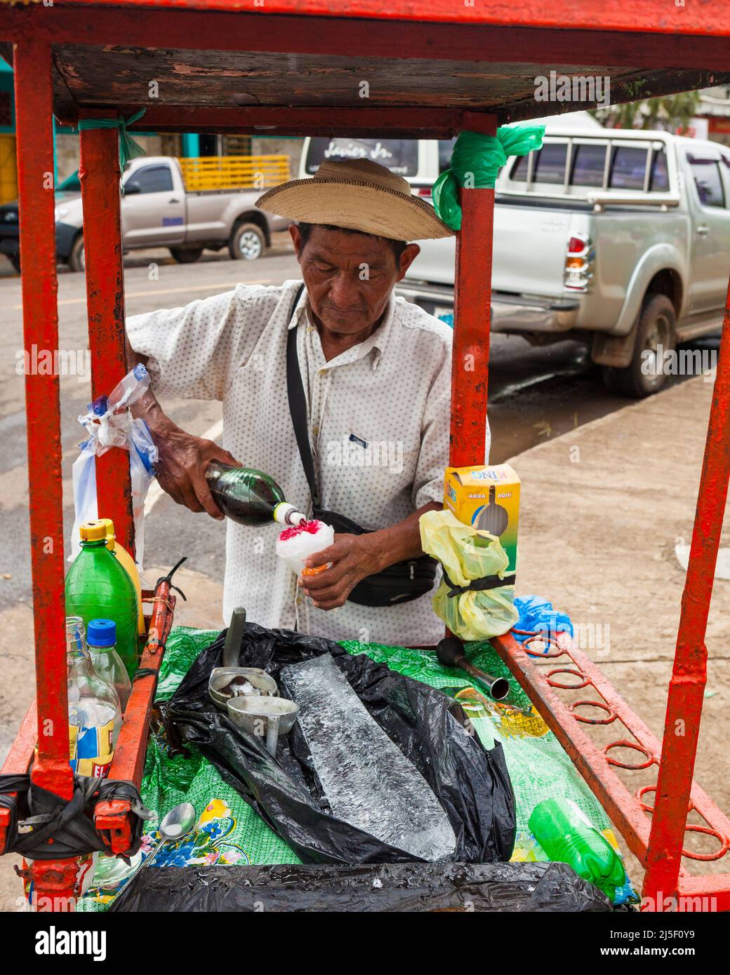 Panamanian man is making a slush drink named Raspao in the center of the town Ocu, Herrera province, Republic of Panama, Central America. Stock Photo
