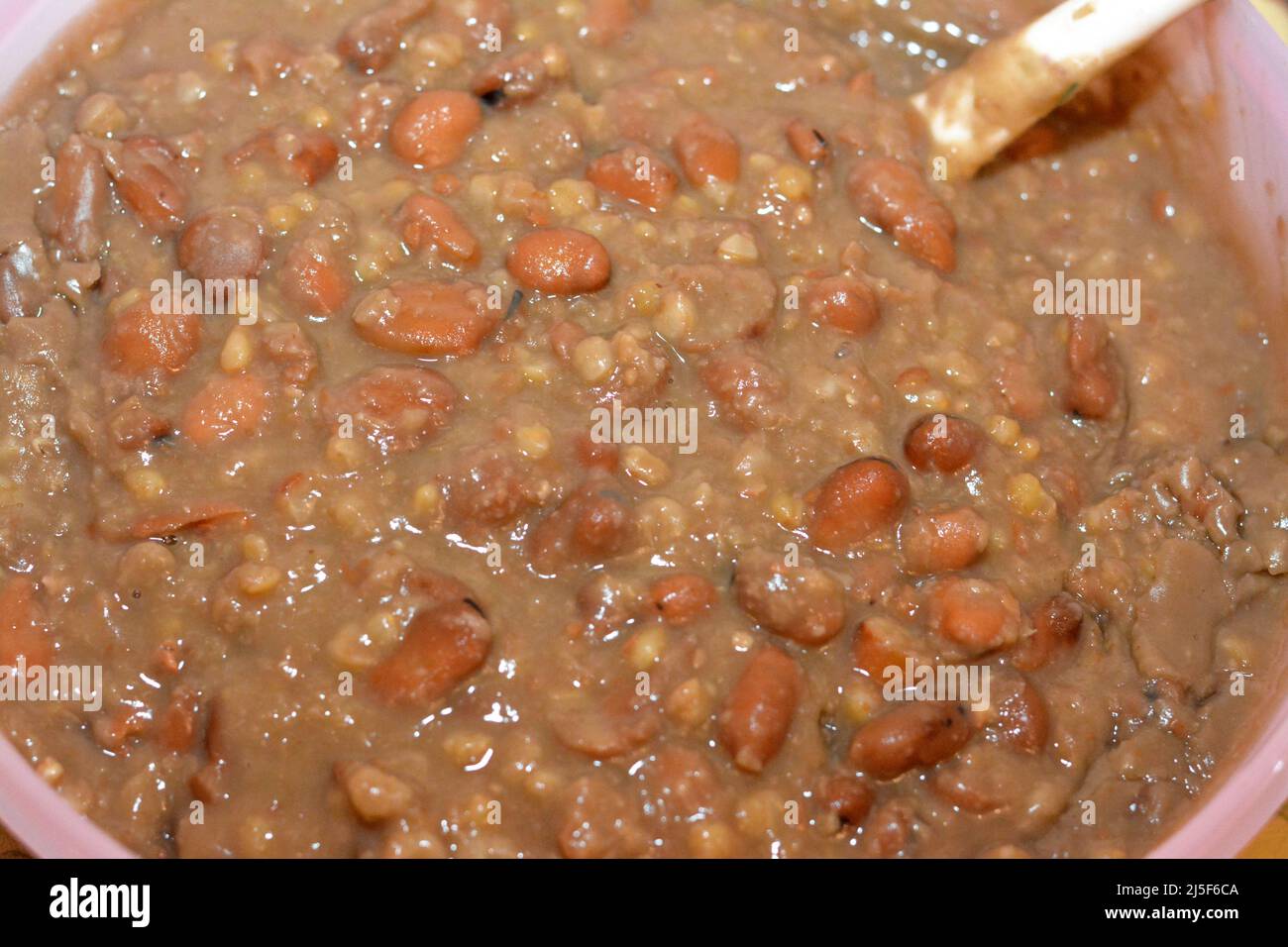 A close up of Egyptian beans which is the main dish and sandwich in the