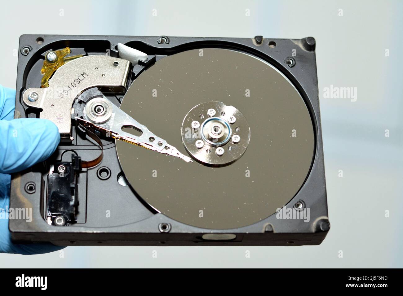 Disassembled computer hard disk drive storage memory with platters