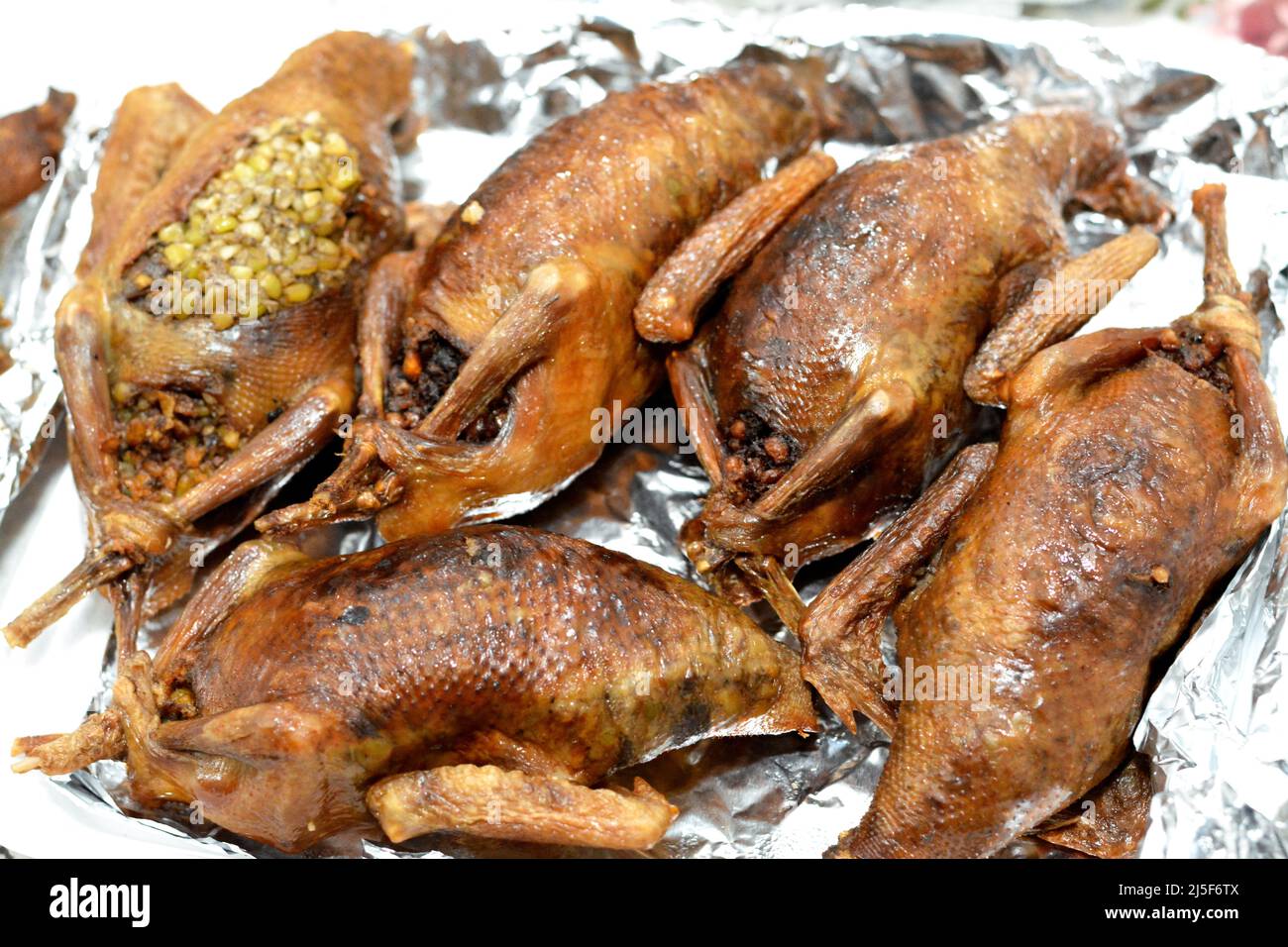 Egyptian Hamam Mahshi or stuffed squab, An Arabic cuisine, Egyptian traditional stuffed pigeon dish filled with rice and Freekeh which is a cracked gr Stock Photo