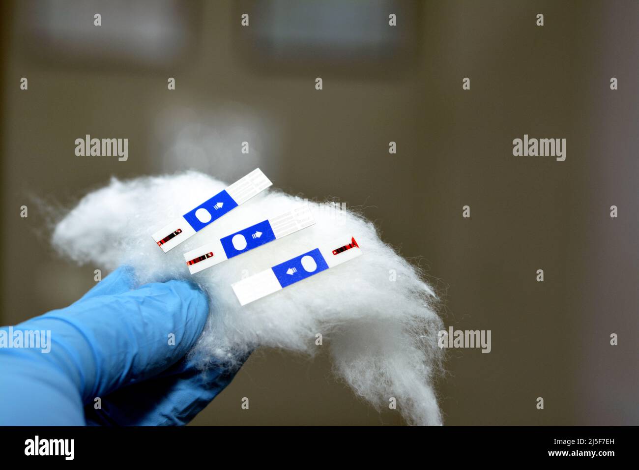 Used blood glucose rapid electronic test strips with blood inside its