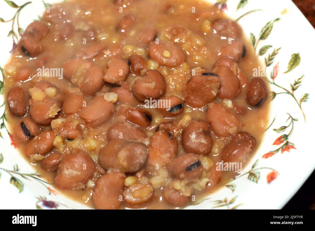 A plate of Egyptian beans which is the main dish and sandwich in the