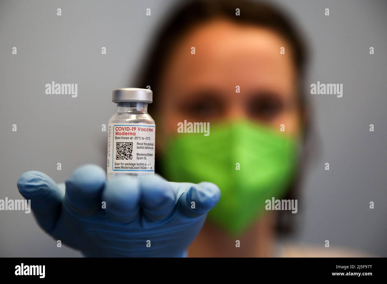 London, UK 22 Apr 2022 - A vaccinator holds a vial containing Spikevax (Moderna) COVID-19 vaccine at a vaccination centre. Credit Dinendra Haria /Alamy Live News Stock Photo