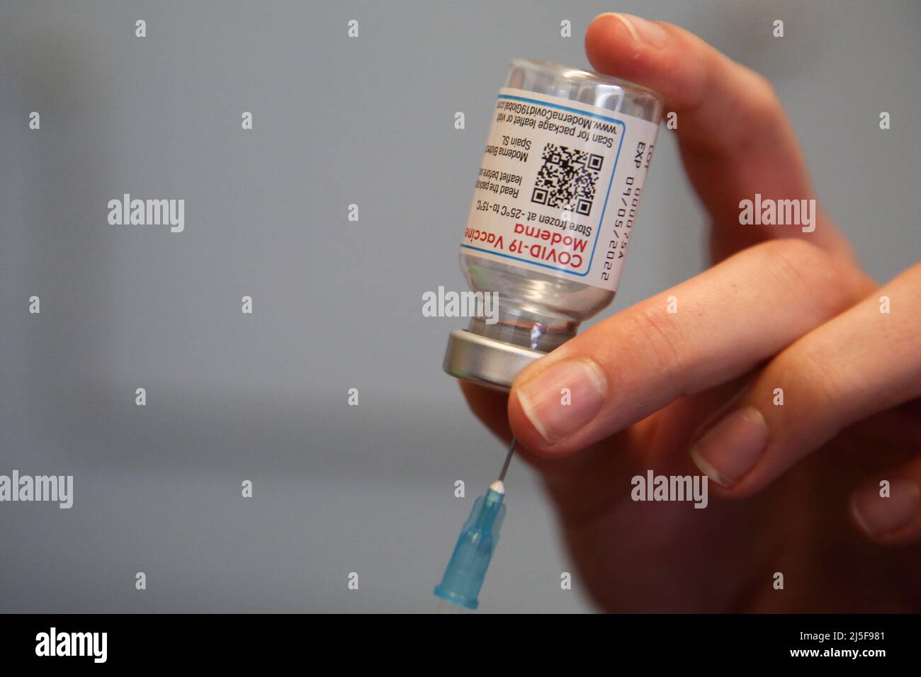 London, UK 22 Apr 2022 - A vaccinator draws the Spikevax (Moderna) COVID-19 vaccine as she prepares to administer the spring booster jab to a person at a vaccination centre. Credit Dinendra Haria /Alamy Live News Stock Photo